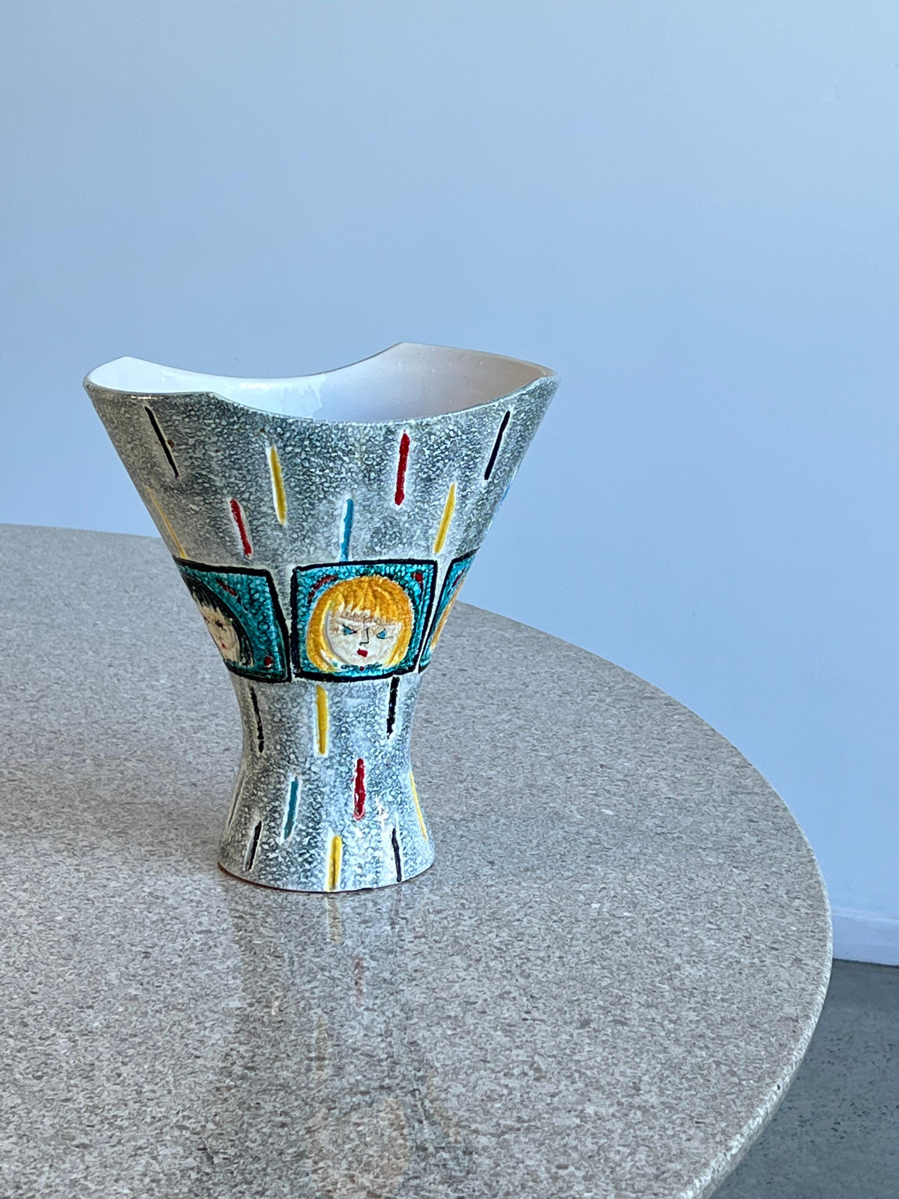 Italian Ceramic Hand Painted vase by Bica 1970.
Stunning pop art by Bica vase hand painted representing a blonde woman and brunette woman. 
A really small chip on the bottom like shown in the photo.
 