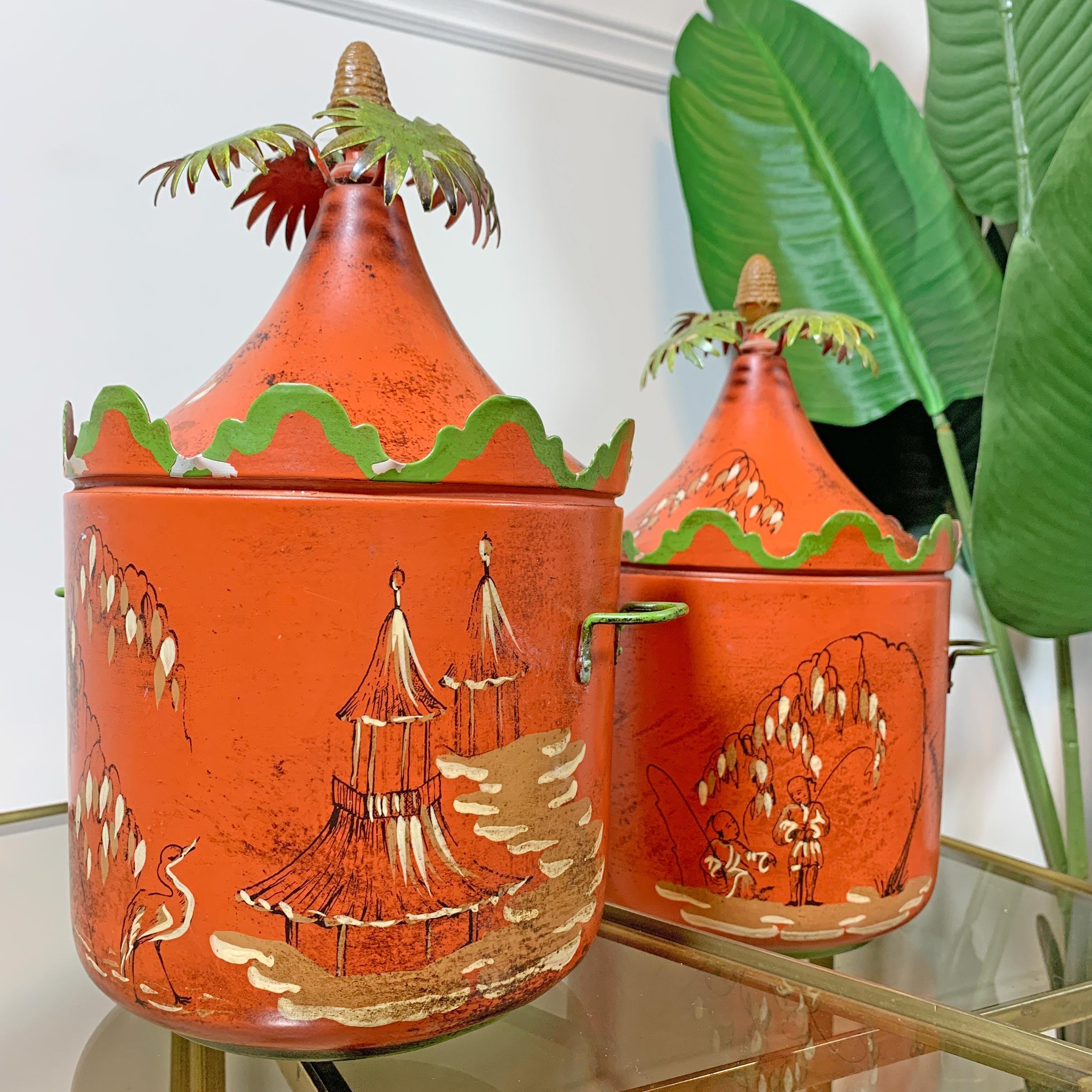 A superb pair of hand painted and crafted metal Ice Buckets, 1950’s Italian, painted with chinoiserie scenes, and palm tree tops.

30cm Height, 21cm Width, (17.5cm Width excluding handles)

Height without lid 18cm