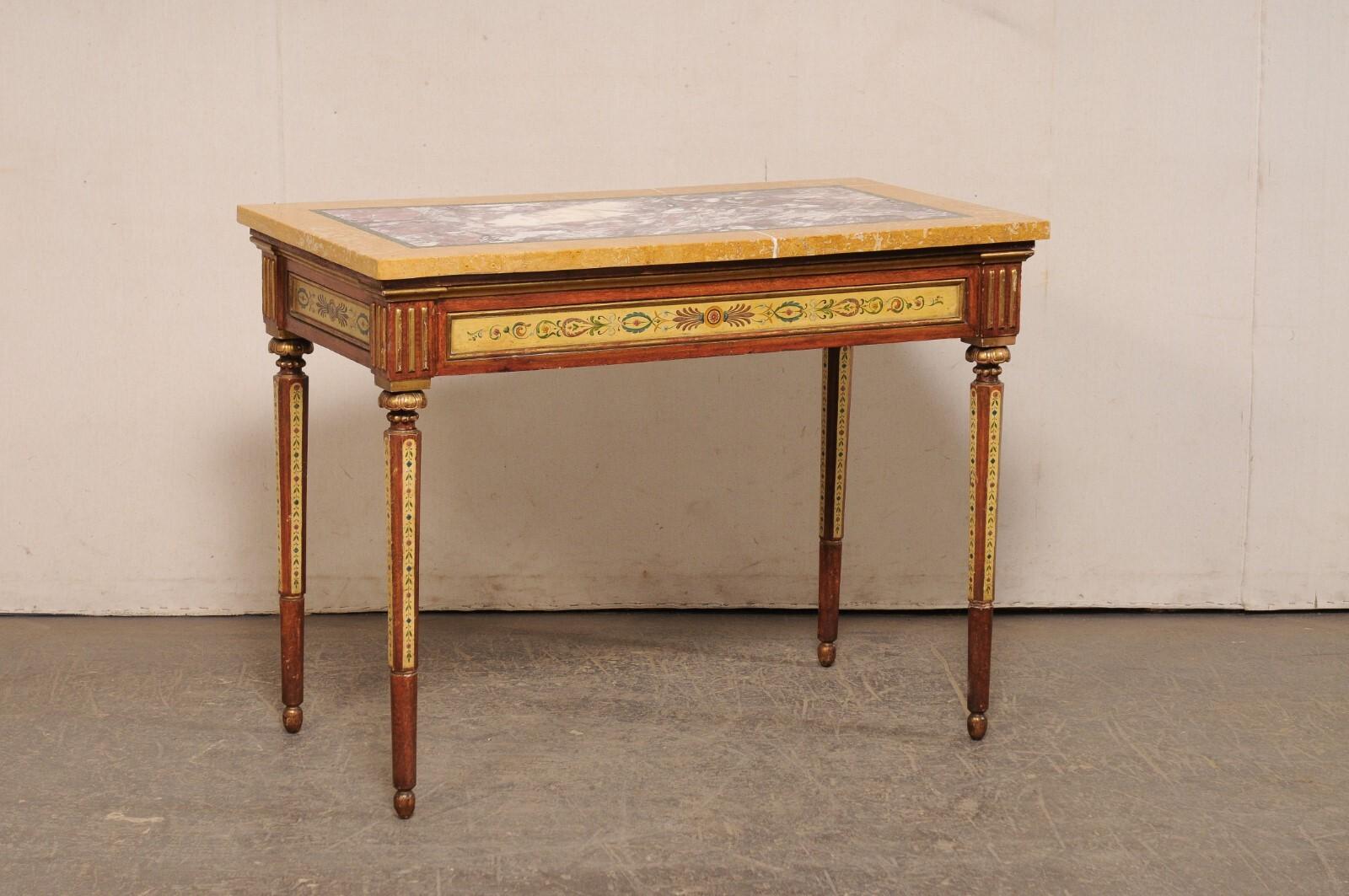 An Italian hand-painted console table, with its original inlaid marble top. This vintage table from Italy has an inlaid marble top, with a rectangular-shaped center in a merlot with white veining, outlined in a thin green banding, and perimeter