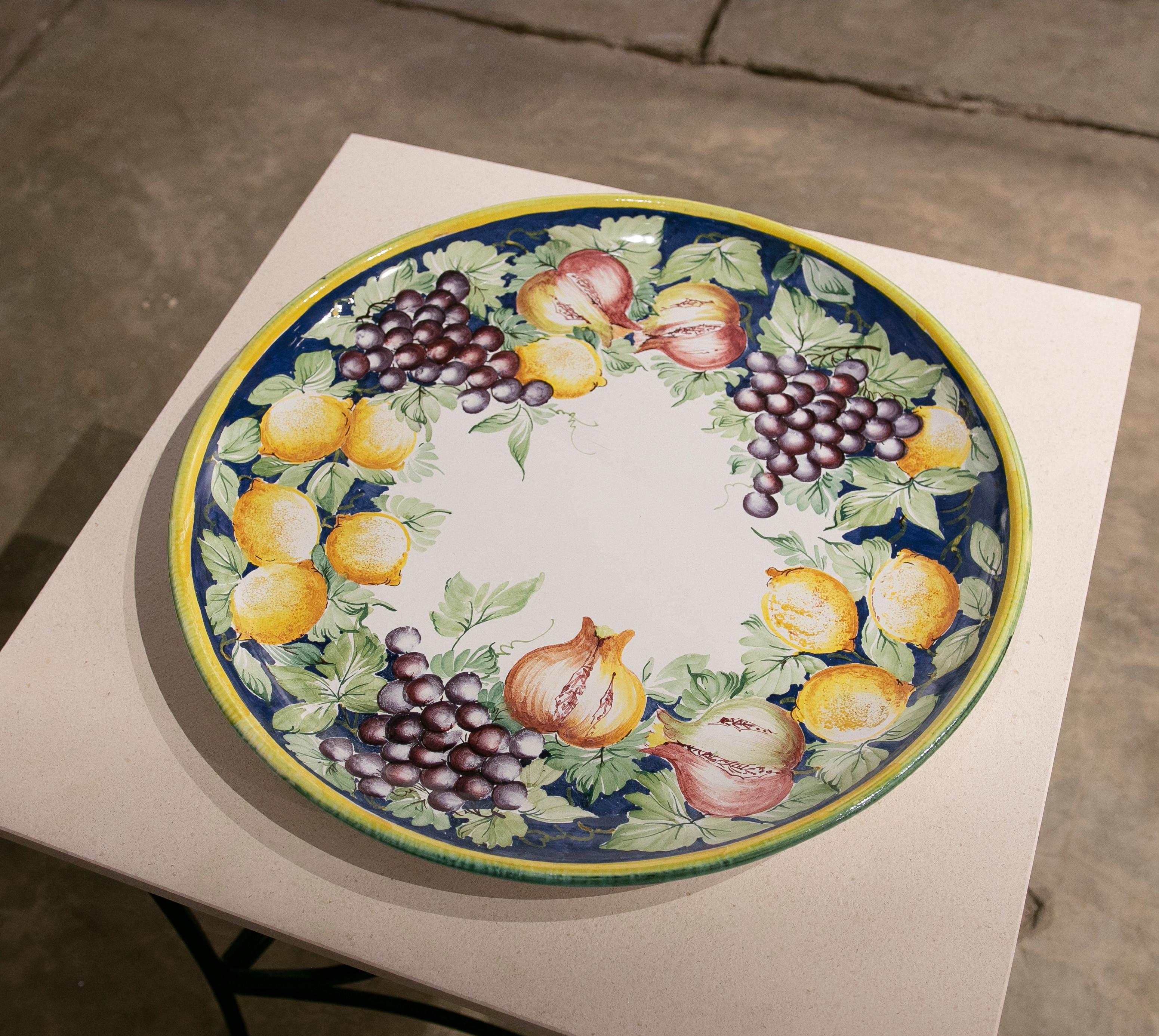 Italian hand painted glazed ceramic dish with fruits and leave.