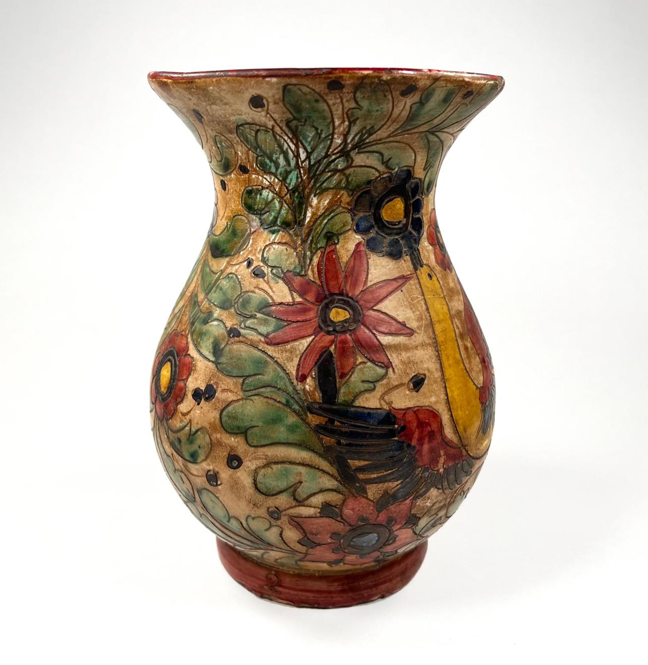 An Italian Majolica Hand Painted Majolica Pottery vase from the late 19th Century. 

The vase is a stunning example of hand crafted Italian Pottery.   Close attention to Birds, foliate and flowers with a 3-Dimensional quality make this piece a show