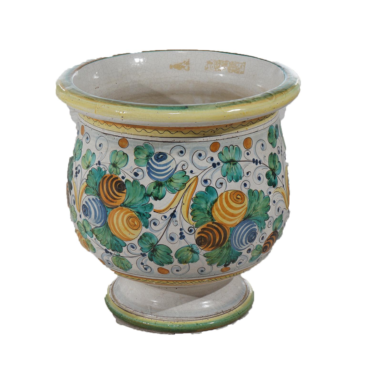 An Italian floor vase offers Majolica terracotta pottery construction with hand painted fruit and foliate elements throughout, 20th century

Measures- 17.5''H x 17''W x 17''D