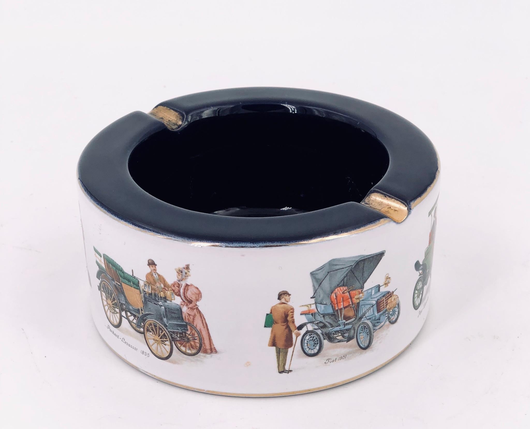 Classic Italian Florentine porcelain ashtray, depicting antique cars like Fiat, from the 1800s with gold accents a very collectible and rare piece.