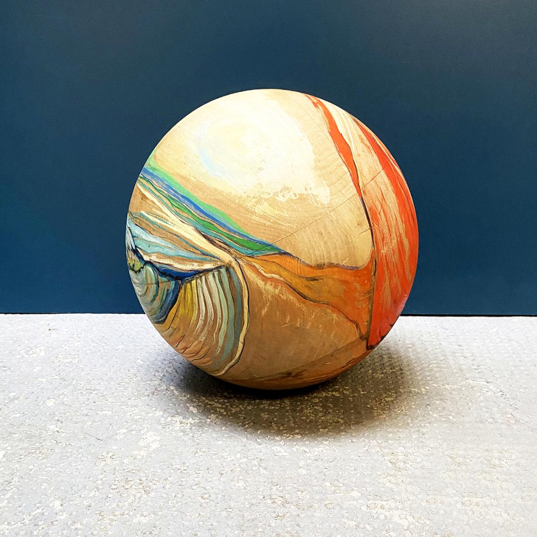 Italian hand painted solid wood decorative sphere with abstract decoration, 1970s
Hand painted solid wood decorative sphere with abstract decoration.
1970s

Very good condition.

Measures: 25 x 24 H cm.