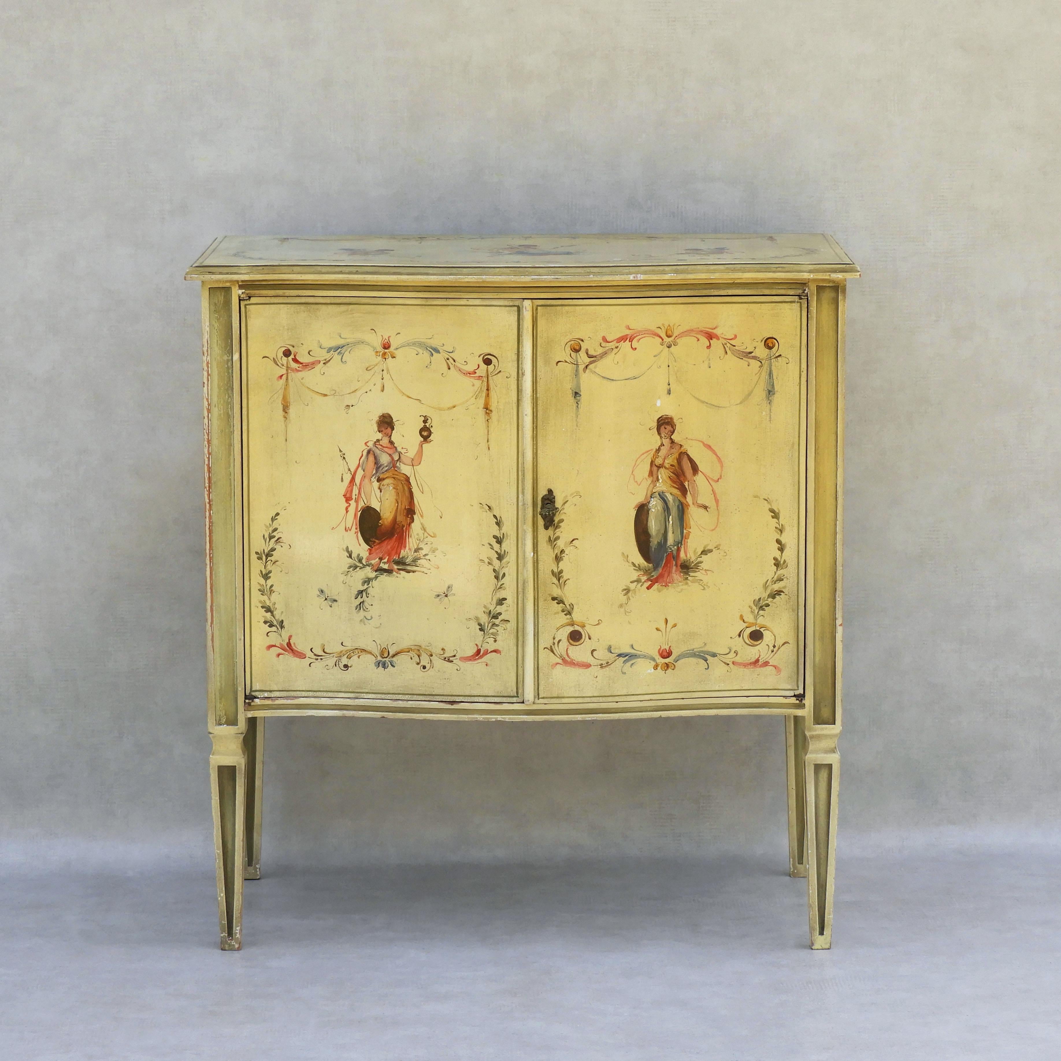 Italian hand-painted Venetian style cabinet, C1960
Beautiful Venetian style painted cabinet c1960s Italy.
Simple neoclassical style, wonderfully complimented by the delicate figurative, floral and scrollwork decoration. 
Charming and practical