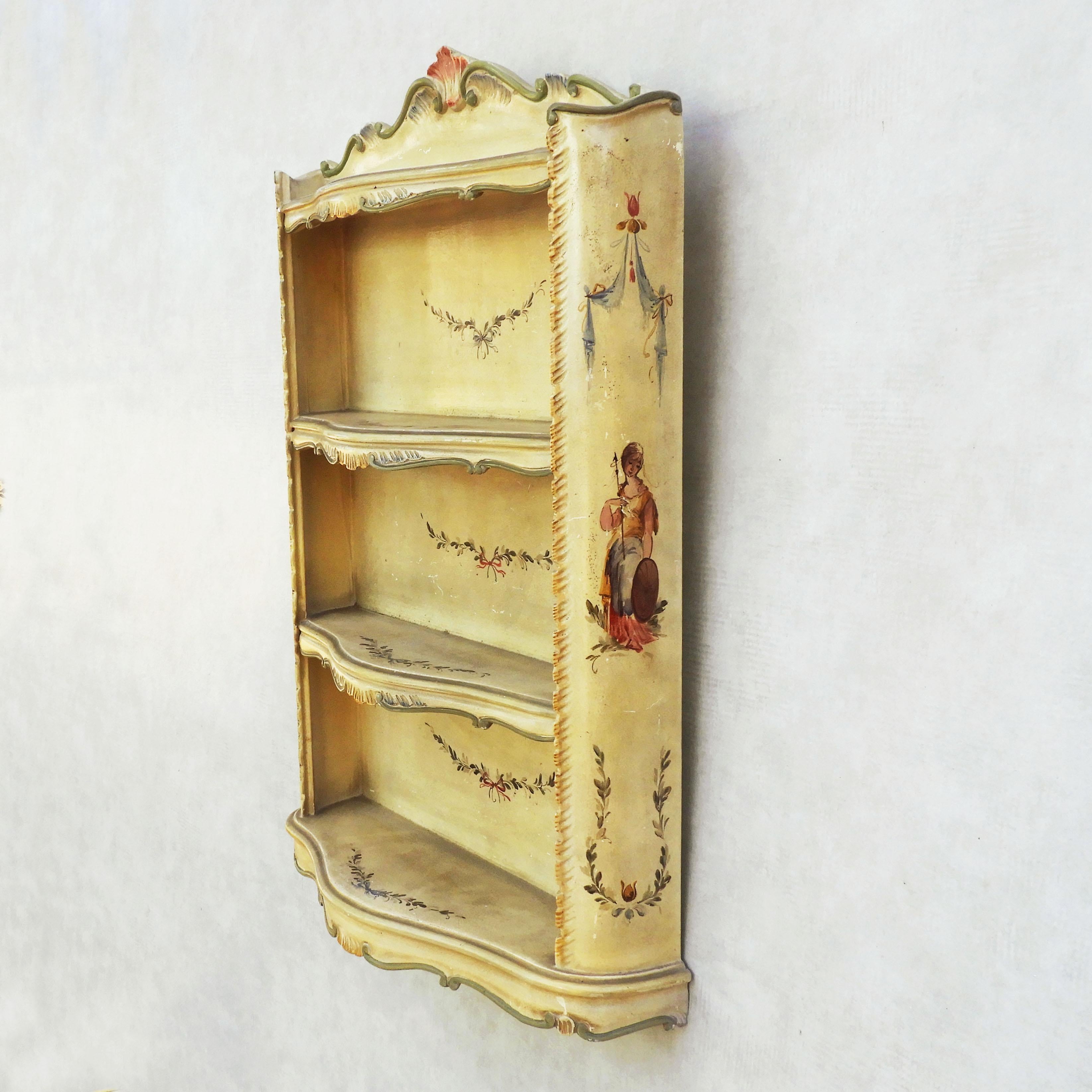 Beautiful Venetian style shelving, c1960s Italy.

Four shelf wall-mounted unit, beautifully hand-painted with figurative, floral and scrollwork decoration. 
We also have a matching cabinet, please see our other listings.
In good vintage