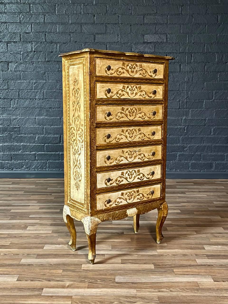 Condition: Original Vintage Condition 

Materials: Hand-Painted Wood, Gilt Accents

This exquisite Italian Venetian dresser from the 1940s showcases the timeless beauty of European craftsmanship. Featuring a hand-painted floral motif with scrolling