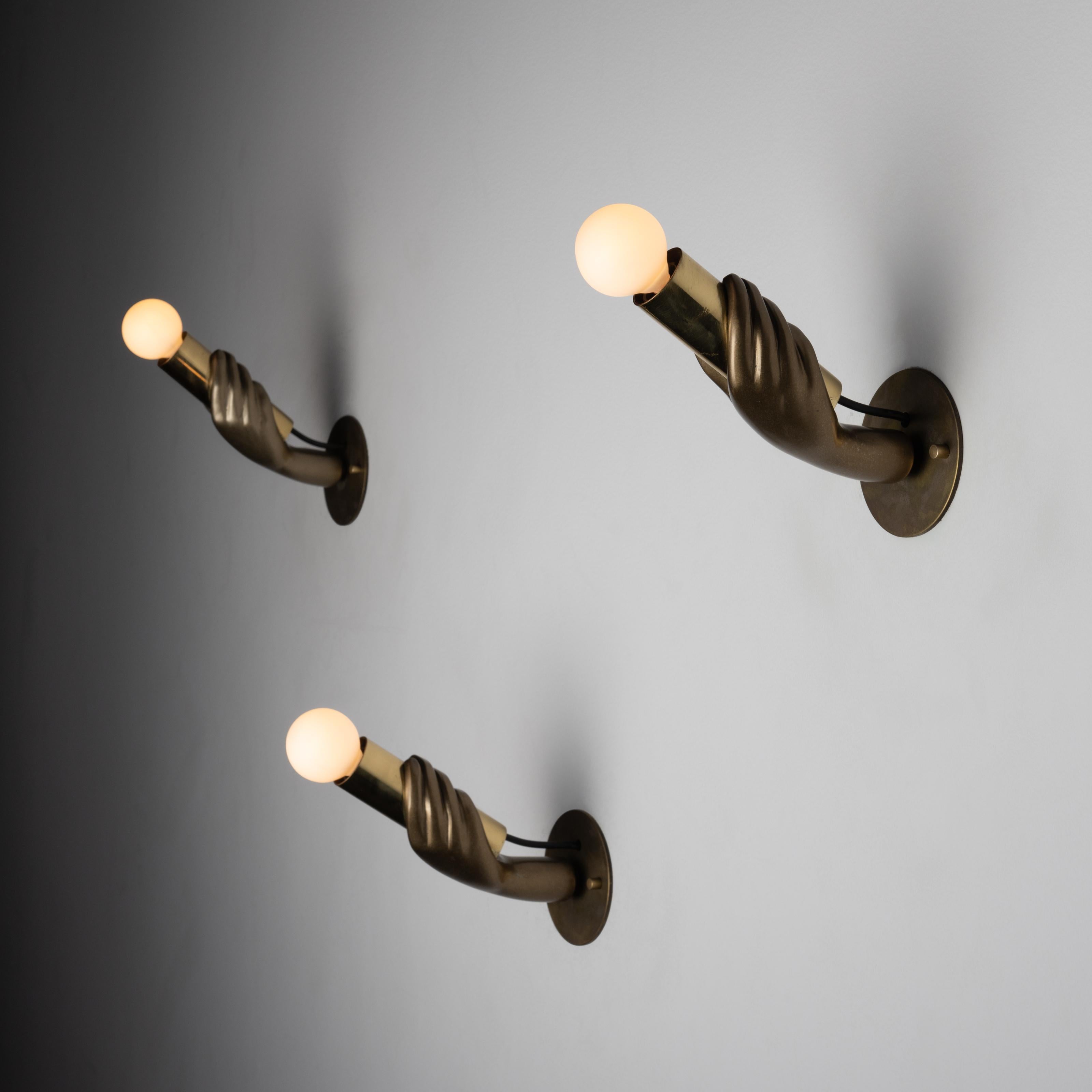 Italian hand sconces. Designed and manufactured in Italy. Figurative impressionist hand sconces fit for a dramatic hallway of any kind. Swivel at the base of the hands allow for articulation. We recommend using 40w maximum E14 bulbs. Rewired for US