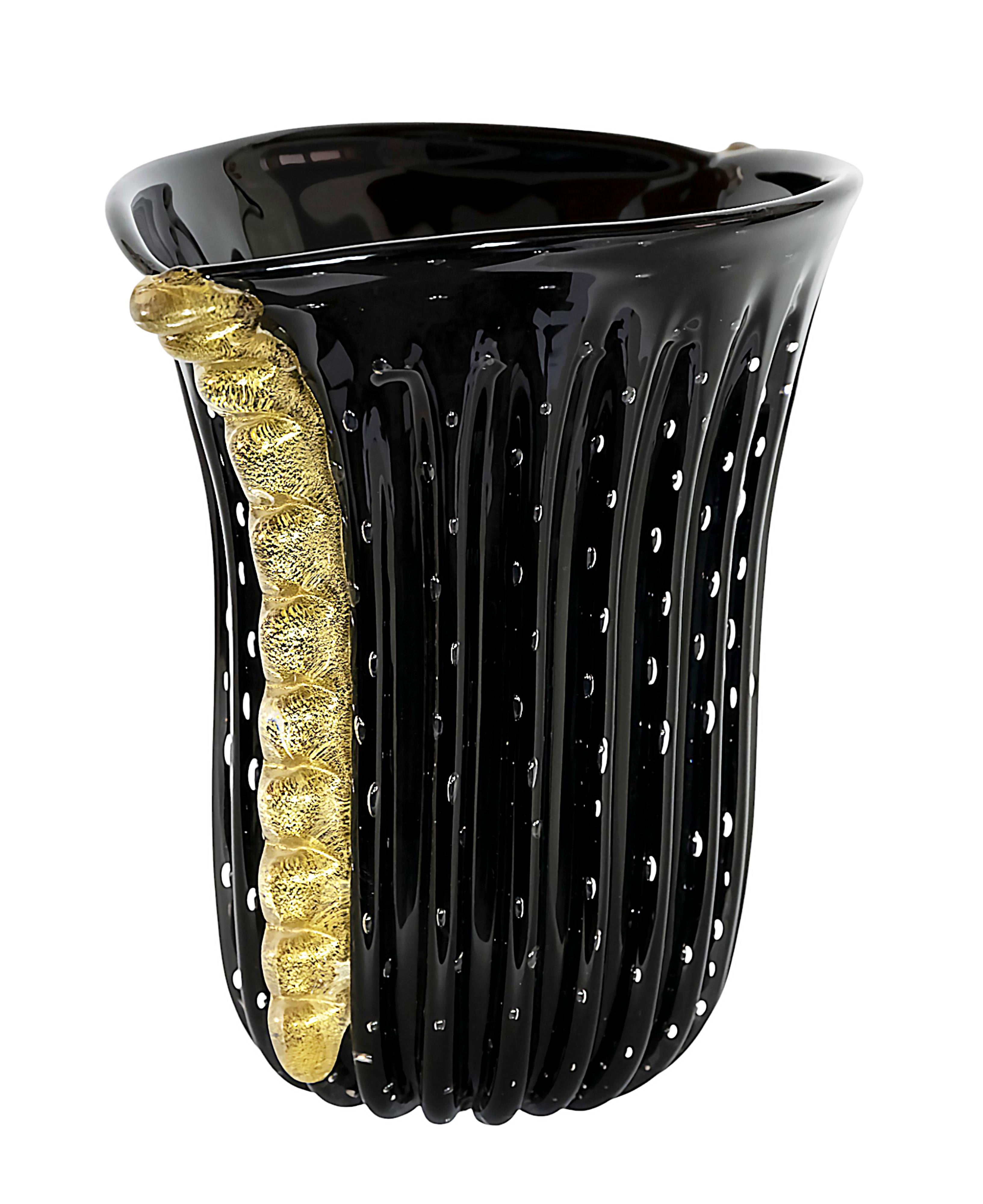 Italian handmade Murano glass vase from circa 1980s.
The glass is in black color with air bubbles inside.
The sides are decorated with inlaid gold dust glass details.
Signed on the base Antica Murano.