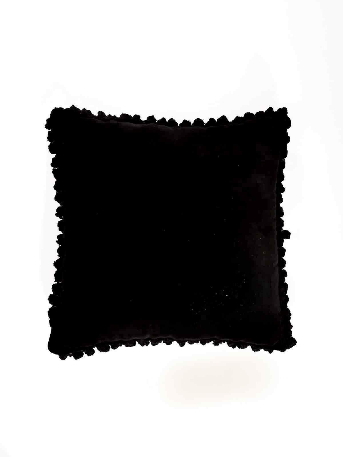 A velvet and polyester pillow with trimmings showing an exotic natural setting. It belongs to the 