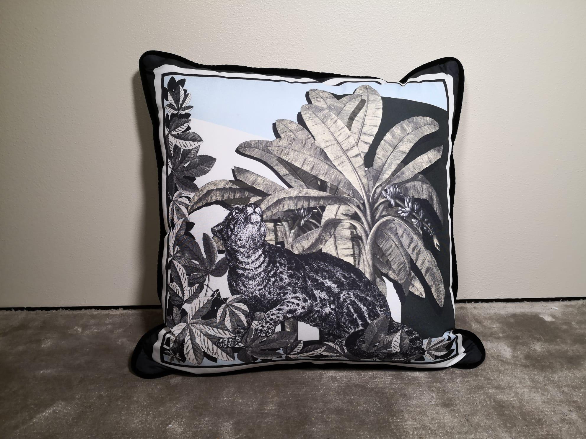 A velvet and polyester pillow showing an exotic natural setting and with animals on it. This pillow comes out as a set of four but is also available as an individual. It belongs to the 