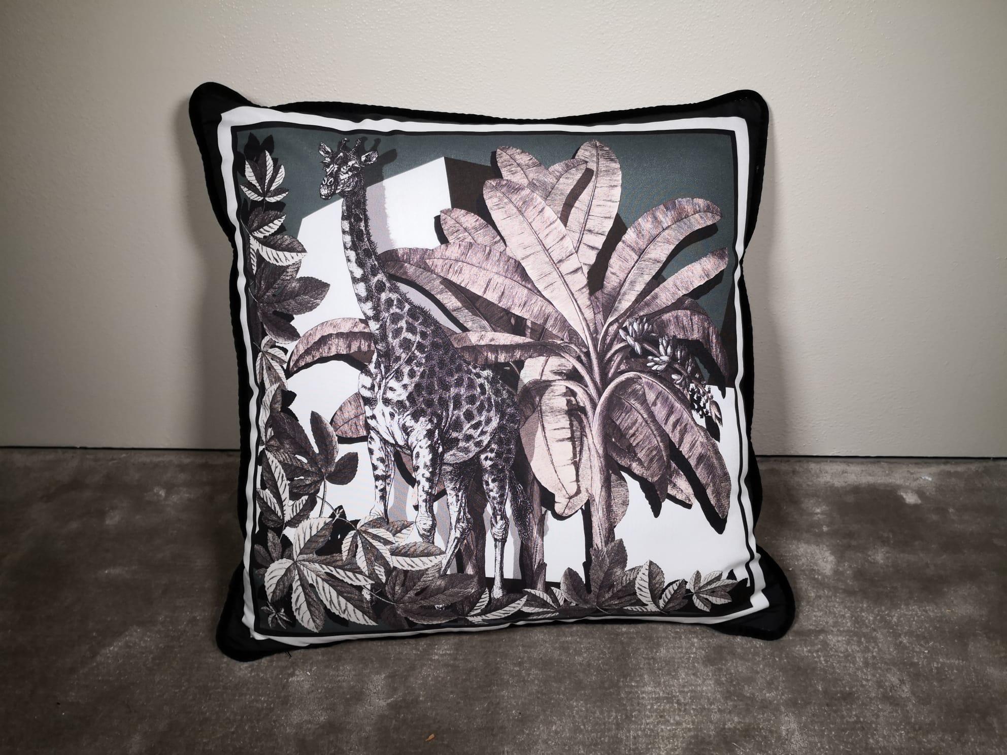 A velvet and polyester pillow showing an exotic natural setting and with animals on it. This pillow comes out as a set of four but is also available as an individual. It belongs to the 