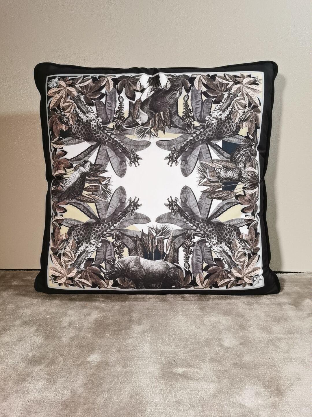 A velvet and polyester pillow showing an exotic natural setting and with animals on it. This pillow comes out as a set of two but is also available as an individual. It belongs to the 