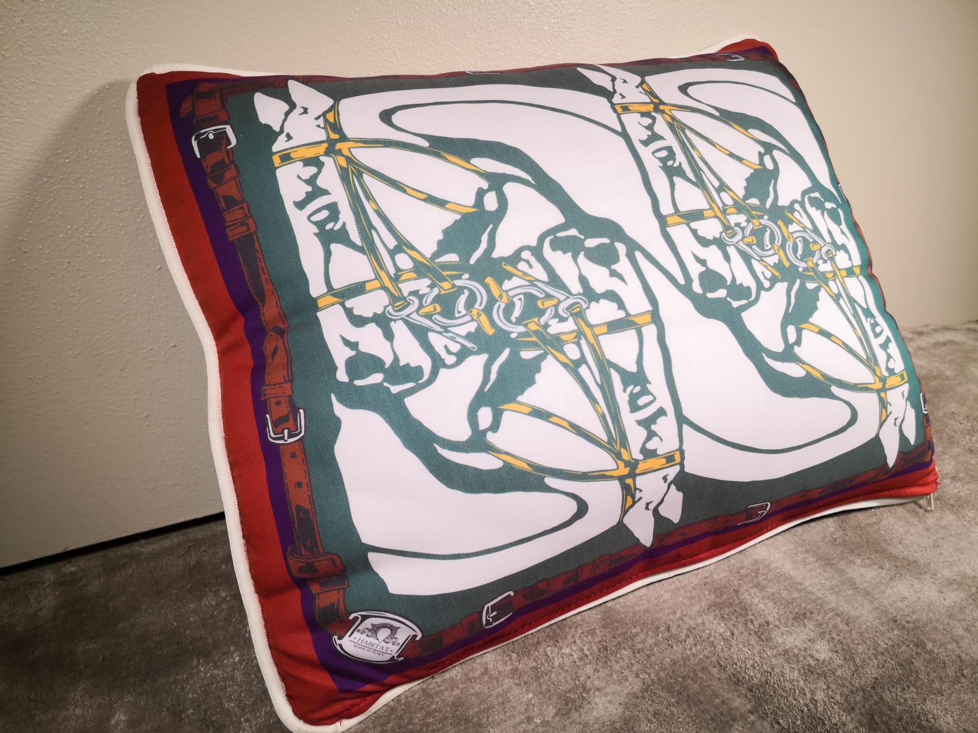 A velvet and polyester pillow showing a contemporary horse heads with horesebit an belts.The main colors are green and red. It's available in other colors, which you can see in our main board.
This pillow comes out as a set of three but is also