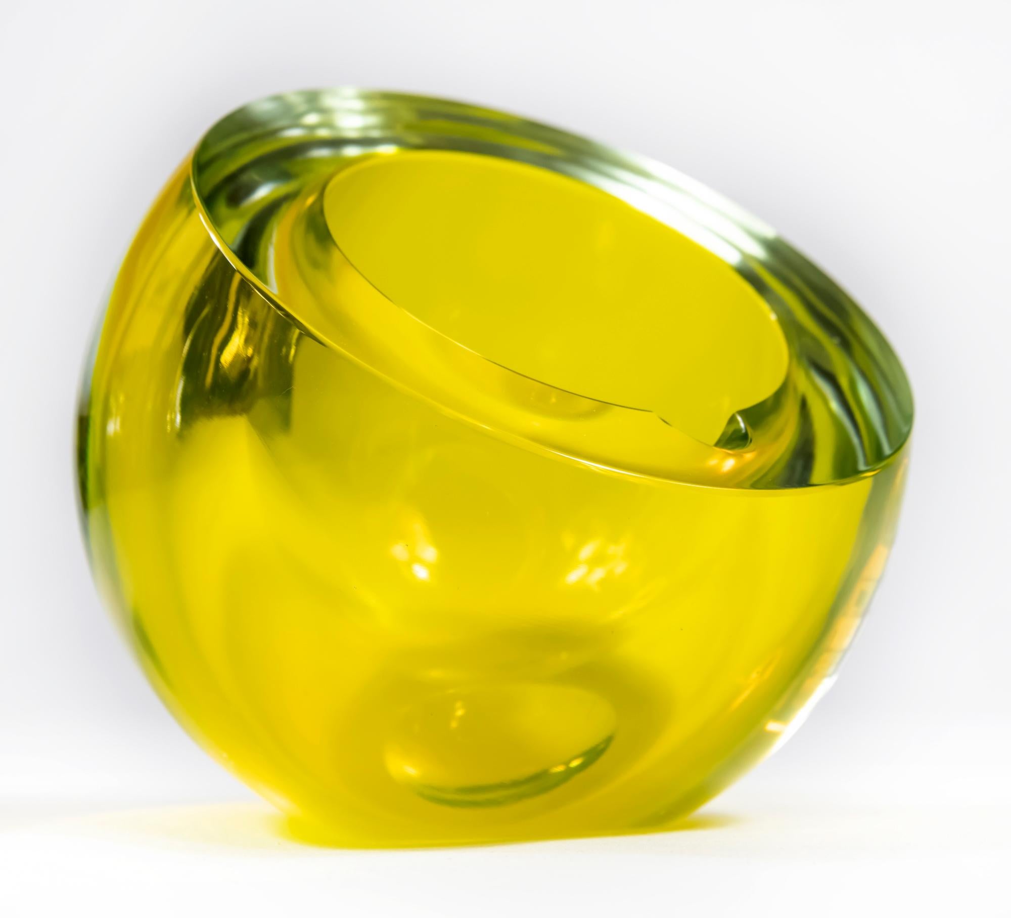 This vintage Italian handmade bowl / ash tray is handmade of yellow Murano glass. The form is asymmetric round with thick edge. It is very heavy.