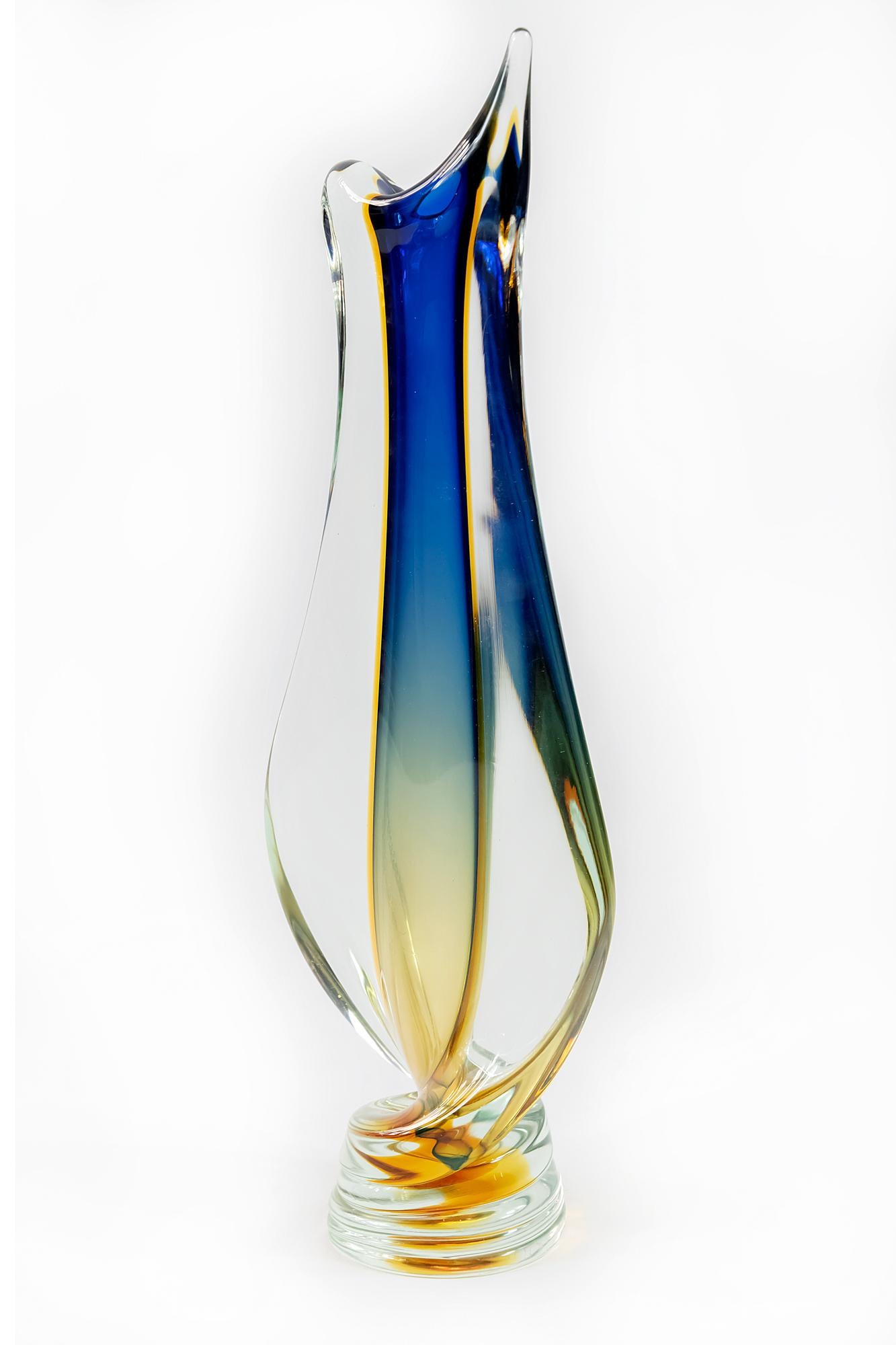 This vintage Italian handmade Sommerso vase is handmade of multi-colour layers Murano glass. The form is asymmetric with twist form base.