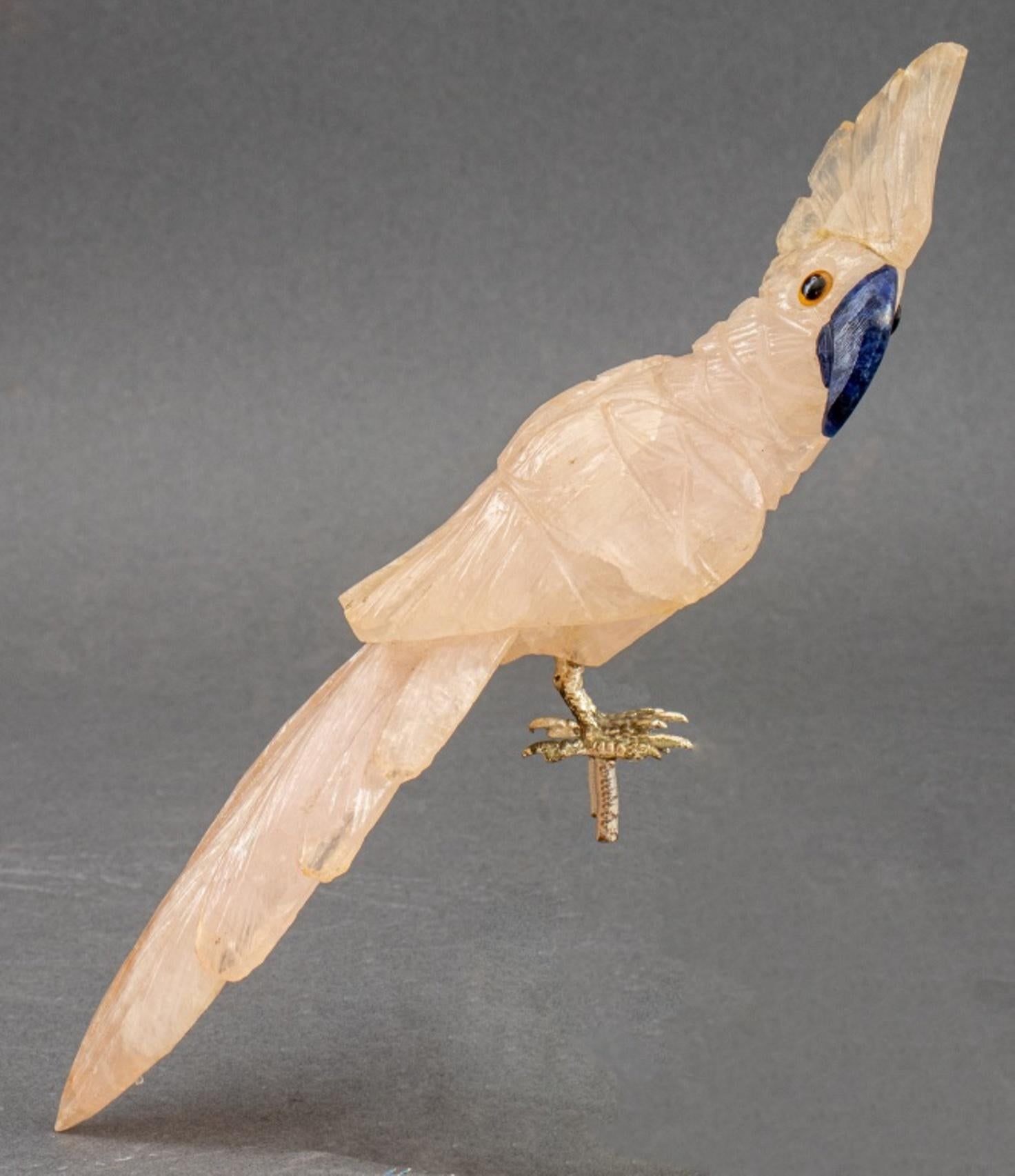 Italian hardstone cockatoo figure, in the Faberge style in quartz with lapis beak and silver mounted feet, formerly on a perch or rock (lacking).

Dimensions:   7.5