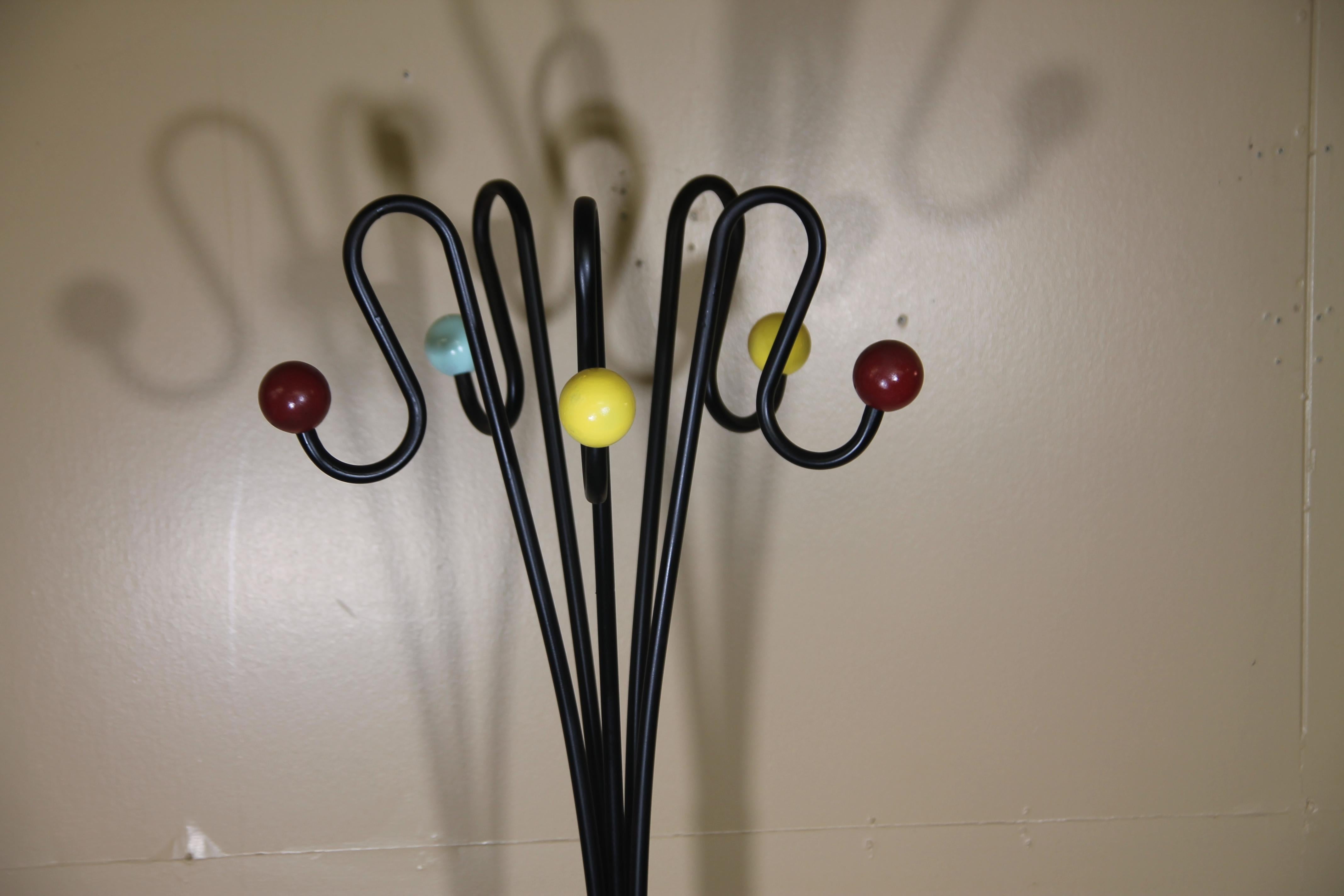 Great Italian hat rack. This was an old new stock frame and wood balls that have been newly painted. Frames were imported into the USA in the 1960s and remained untouched until we acquired them.