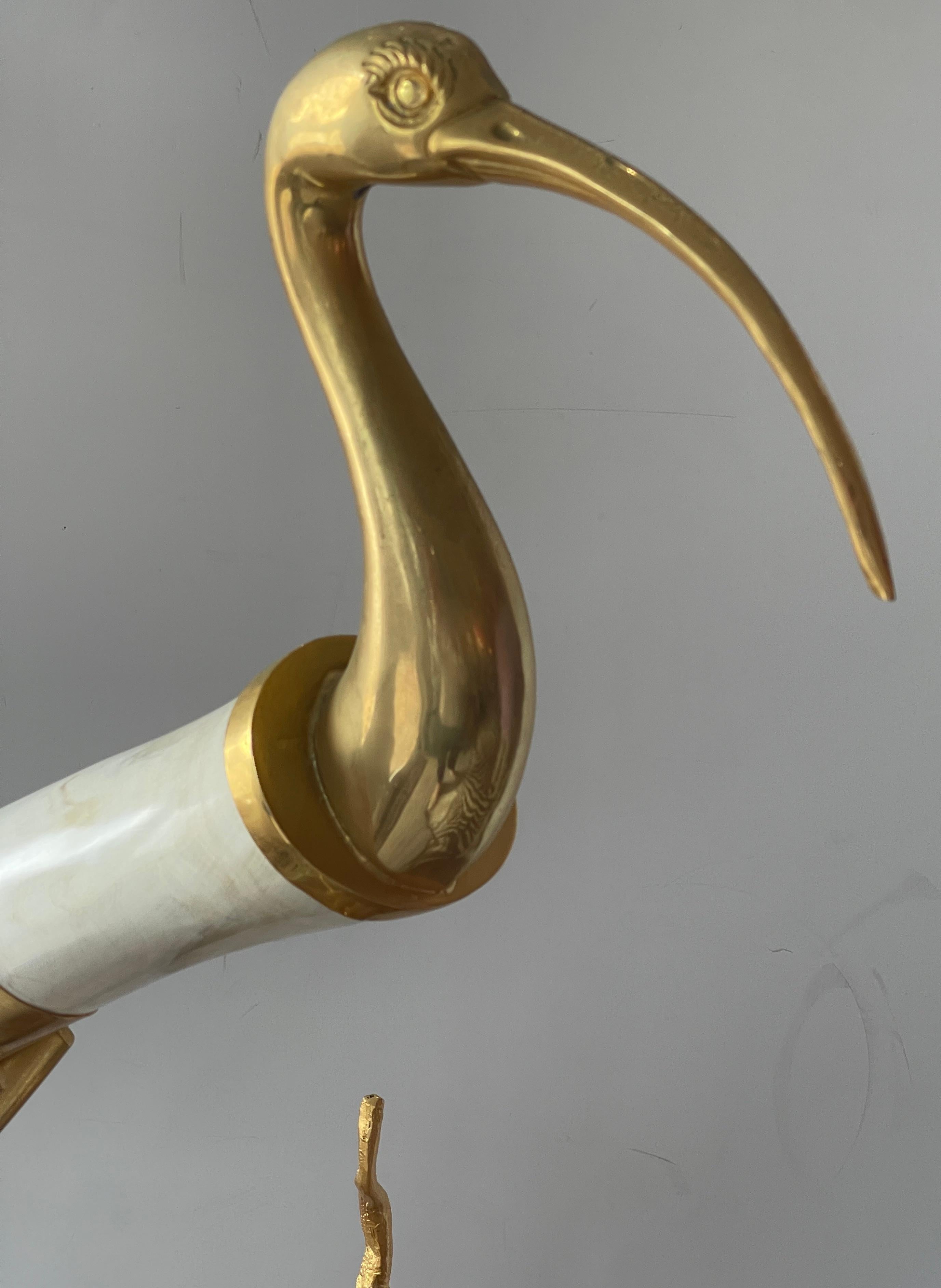 Just in , this Hauy Pouigo Perched Bird Sculpture with natural Horn and Dore Bronze.
This is a wonderful example of Hauy Pouigo artistic design, made in Florence Italy circa 1970s
This sculpture is of a large bird that is perched on a Dore Bronze