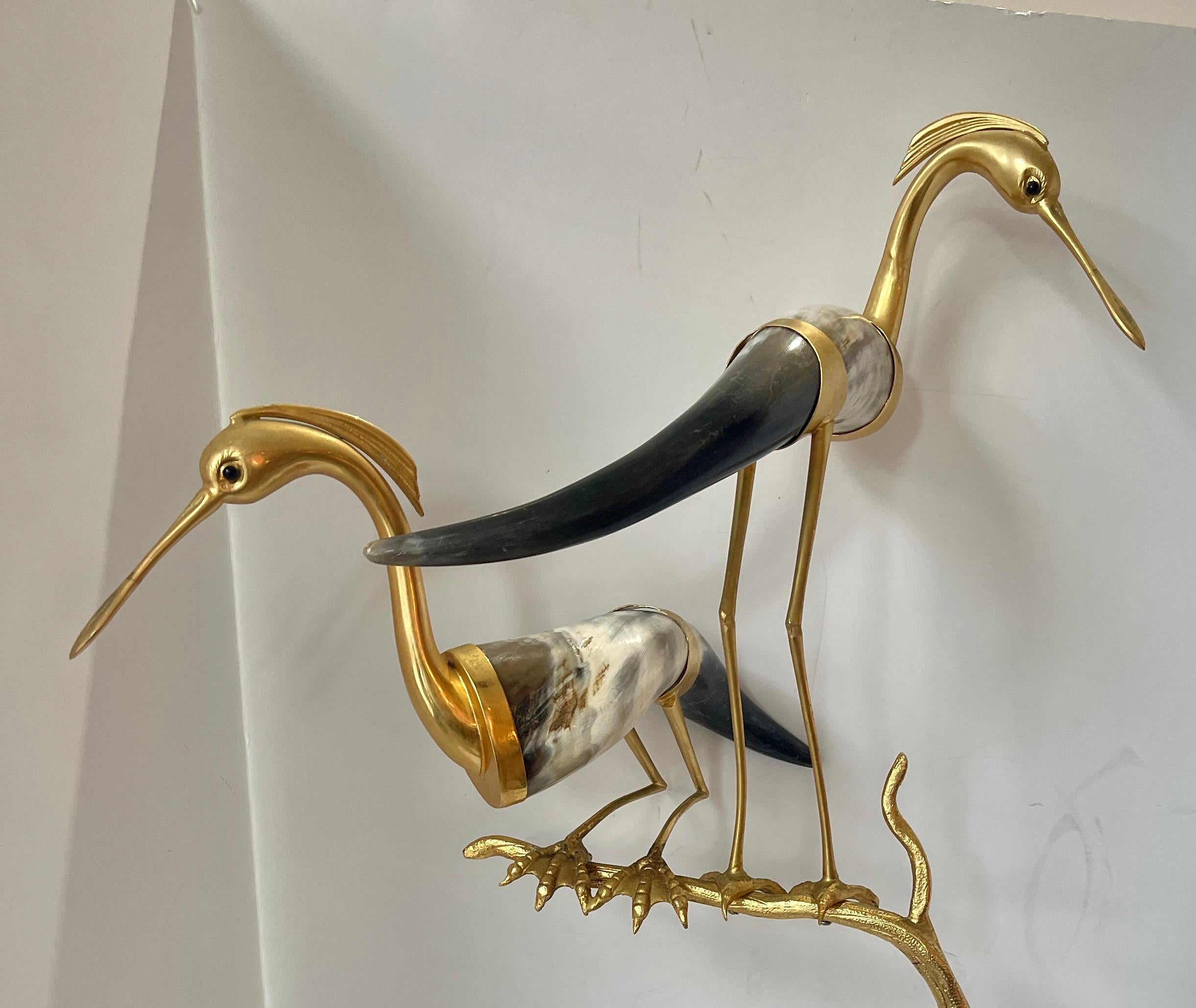Just in , this Hauy Pouigo Perched Bird Sculpture with natural Horn and Dore Bronze.
This is a wonderful example of Hauy Pouigo artistic design, made in Florence Italy circa 1970s
This sculpture is of a large bird that is perched on a Dore Bronze