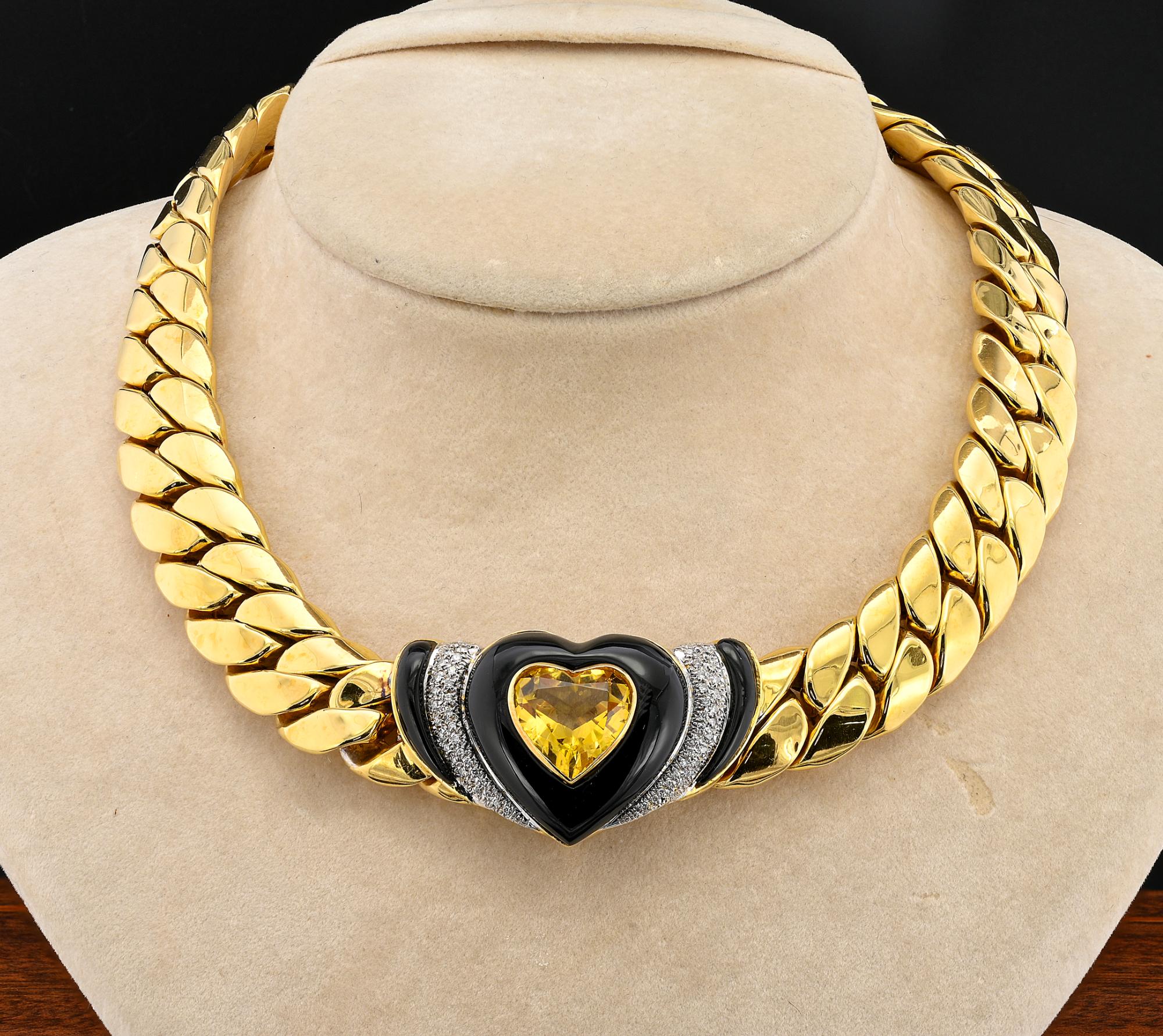 This fascinating estate Italian necklace is a striking example dating 1975 circa
Entirely made of solid 18 KT gold
Large Cuban links chain leading to a superb centre styled with a heart cut natural Citrine of lovely honey gold color nestled in a