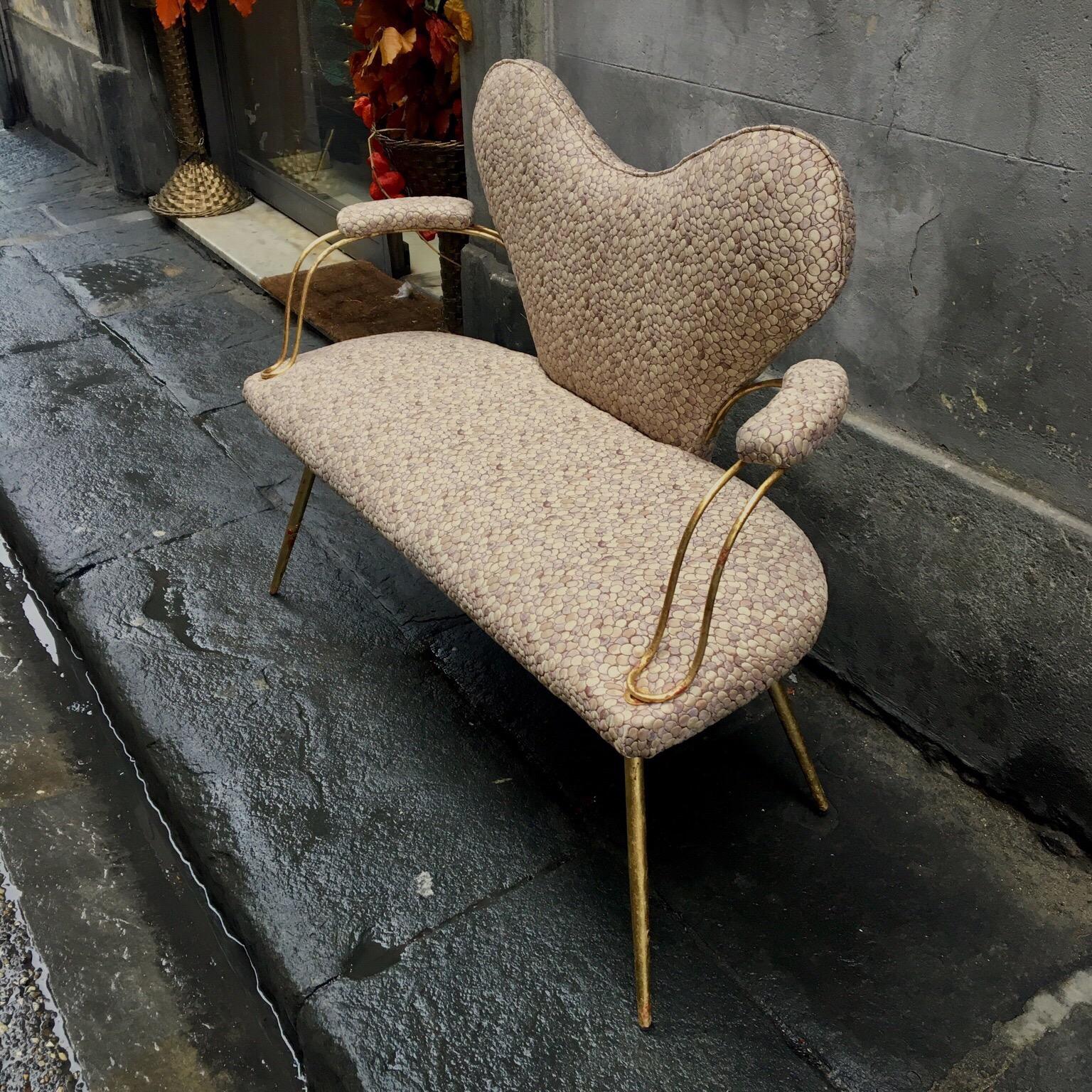 Italian heart shaped small padded sofa, newly upholstered with silk brocade fabric, neutral colors, metal golden leaf. Please note that the metal golden leaf is original of the period and thus shows the signs of age and use, that gives to the piece