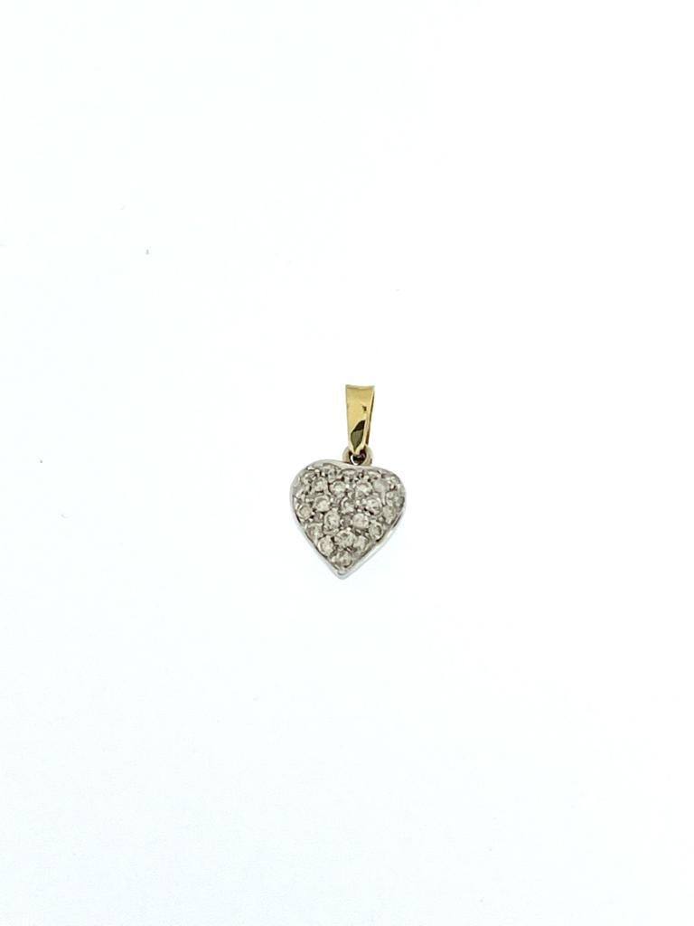 The Italian Heart Yellow and White Gold Pendant with Diamonds is a striking and beautifully crafted piece of jewelry, reflecting the elegance of Italian design. This heart-shaped pendant is made from a combination of yellow and white gold, both of
