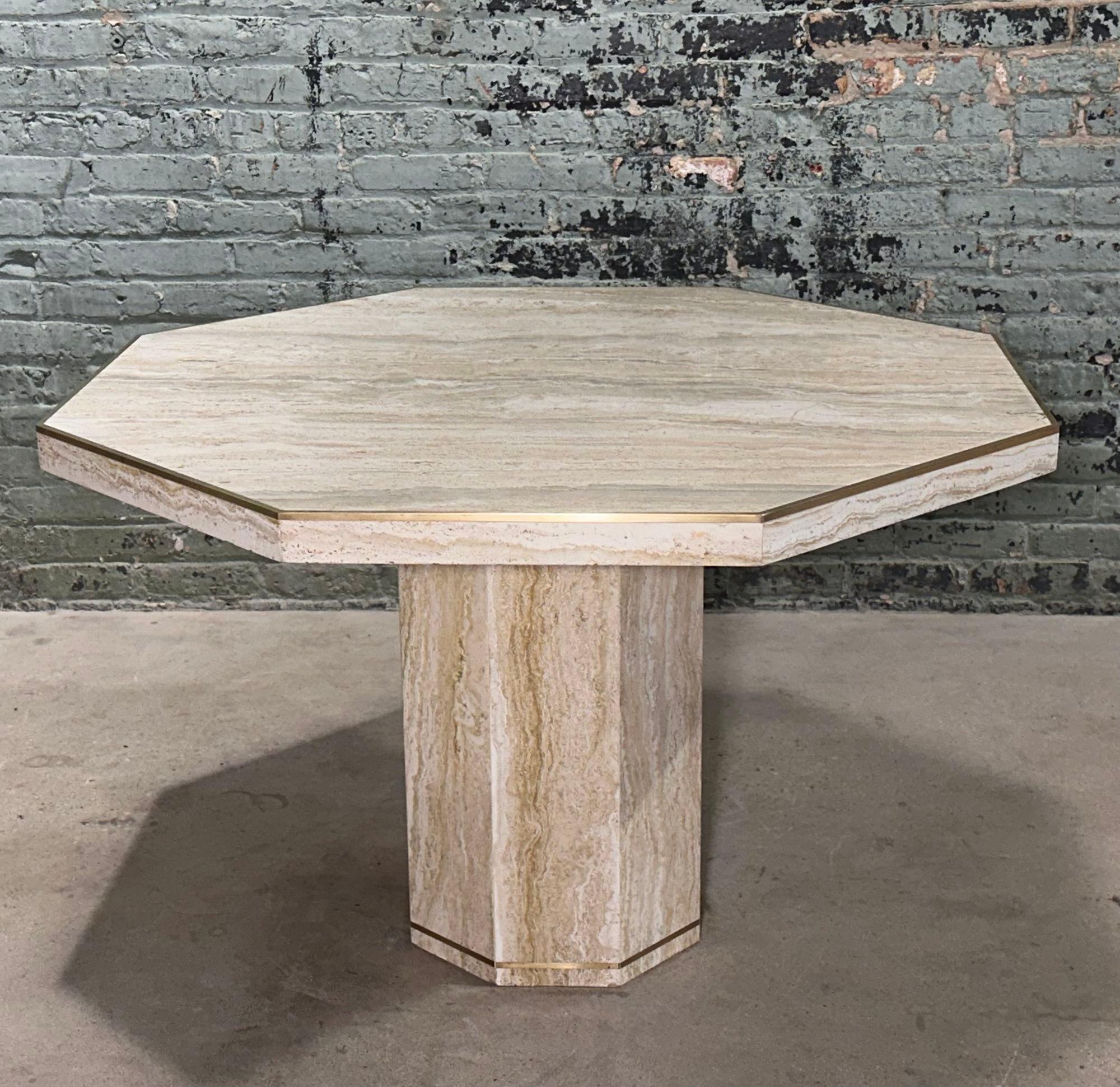 Italian Hexagon Travertine/Brass Dining/Center Table, Italy 1970. Table has beautiful brass around the edges of table and base.
Measures 43.75