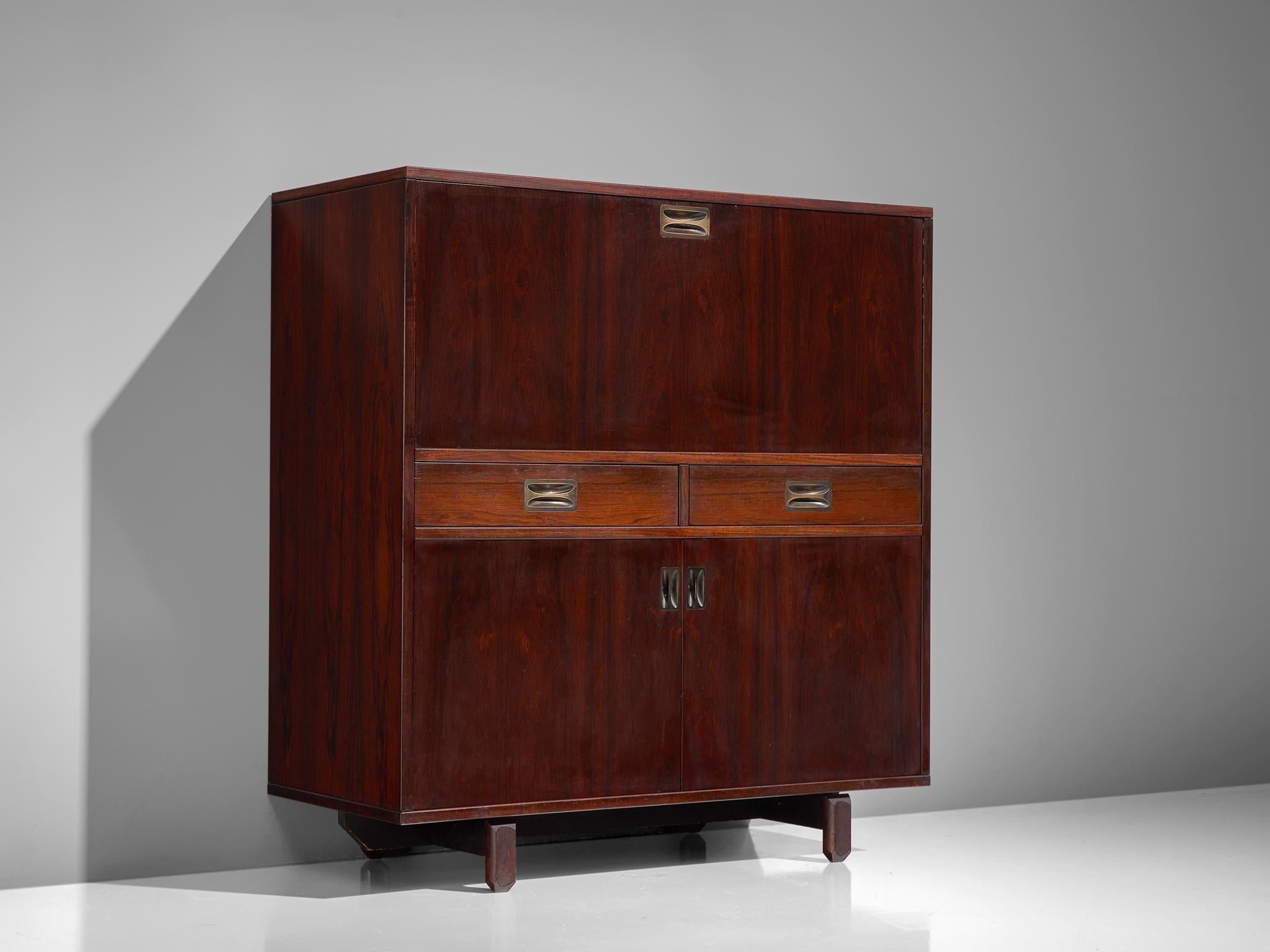 High sideboard, in rosewood and solid brass handles, Italy, 1950s.

This exquisitely finished cabinet is executed in rosewood. The high board features architectural features in the sense that it is built up of various blocks that form a unified