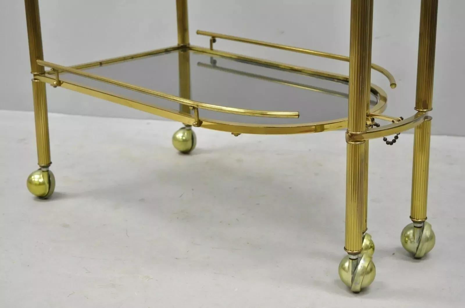 Italian Hollywood Regency Brass Swivel Rolling Bar Cart Server with Smoked Glass For Sale 5