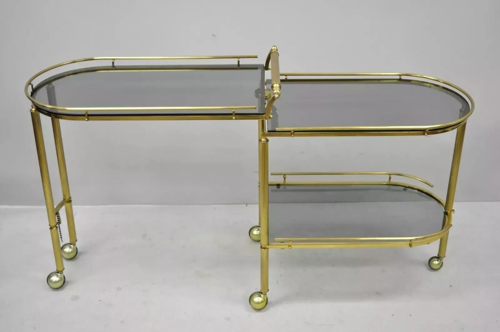 Italian Hollywood Regency Brass Swivel Rolling Bar Cart Server with Smoked Glass In Good Condition For Sale In Philadelphia, PA
