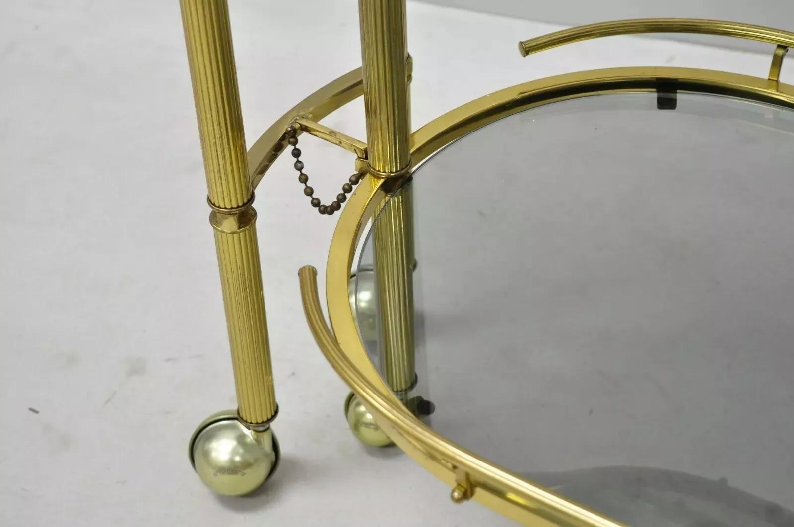 Italian Hollywood Regency Brass Swivel Rolling Bar Cart Server with Smoked Glass For Sale 3