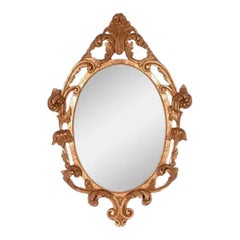 Italian Hollywood Regency Carved Wood Oval Mirror with Gold Leaf and Acanthus