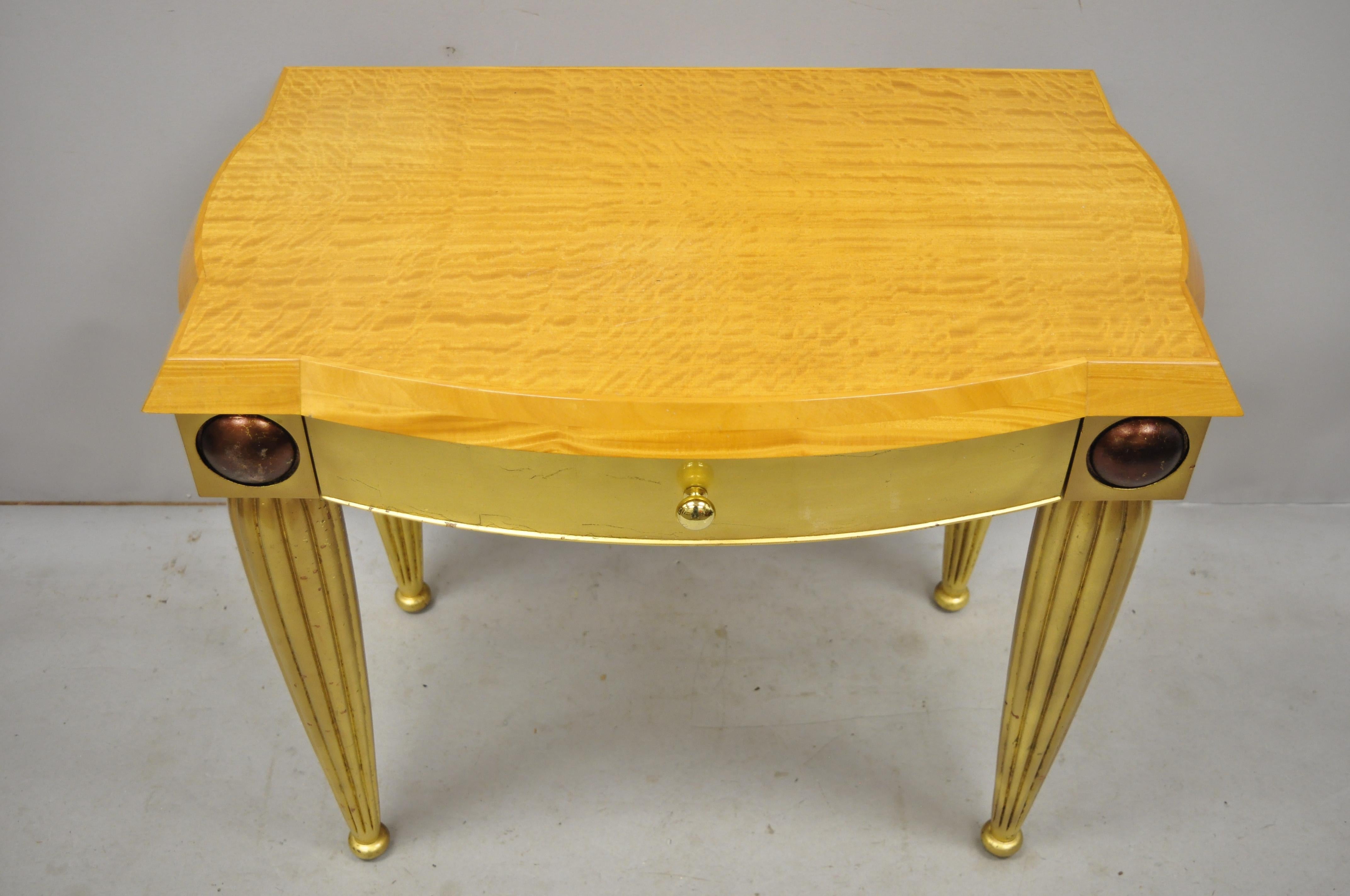 Italian Hollywood Regency curly maple gold gilt leaf 1 drawer console hall table. Item features curly maple top, gold leaf finish to base, beautiful wood grain, distressed finish, 1 drawer, solid brass hardware, great Italian craftsmanship, great