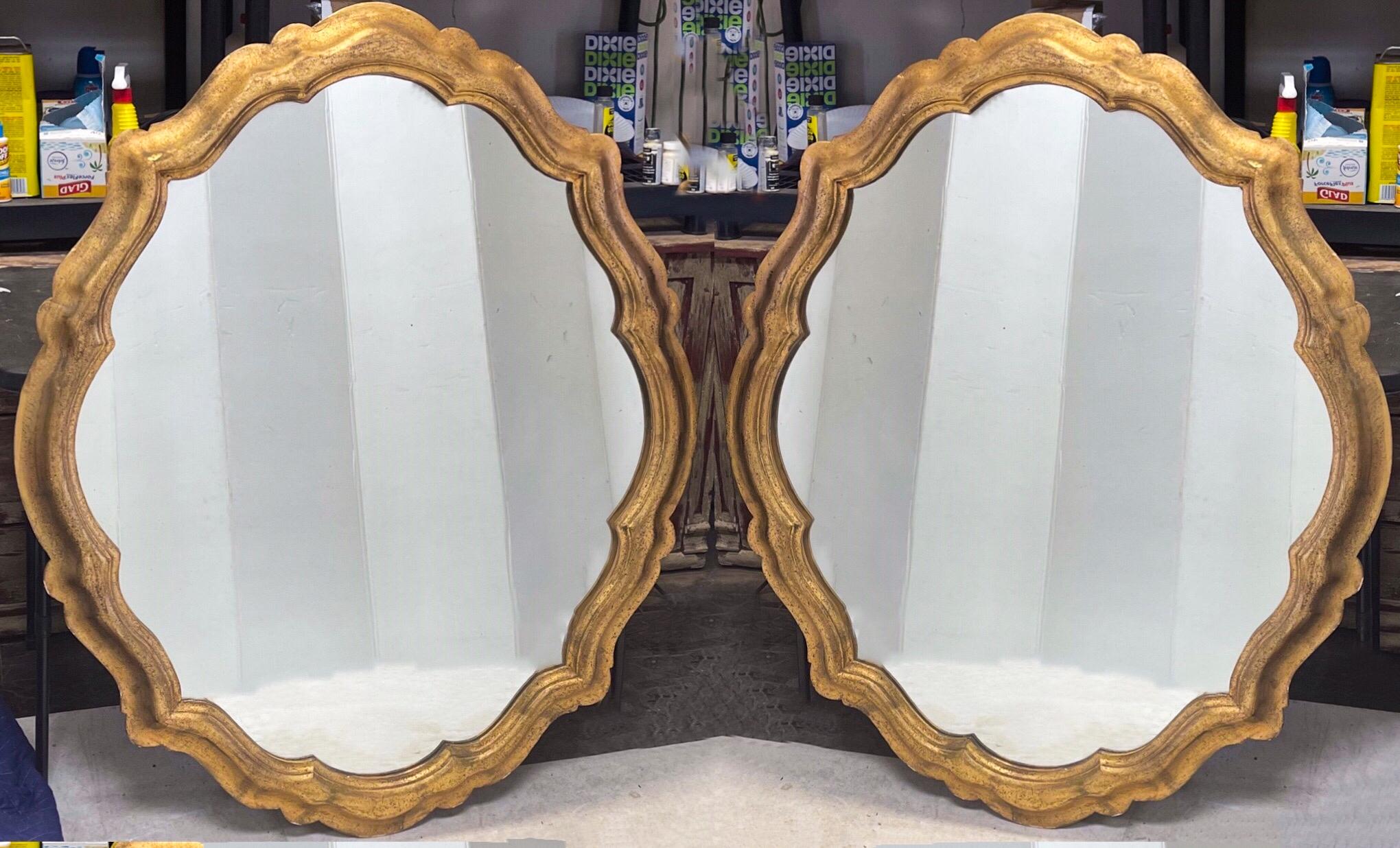 Love these! This is a large scale Italian Hollywood Regency Era pair of carved giltwood mirrors. The mirrors date to the 1960s. I love the cartouche…it is both simple and special simultaneously. They are marked and in very good condition.