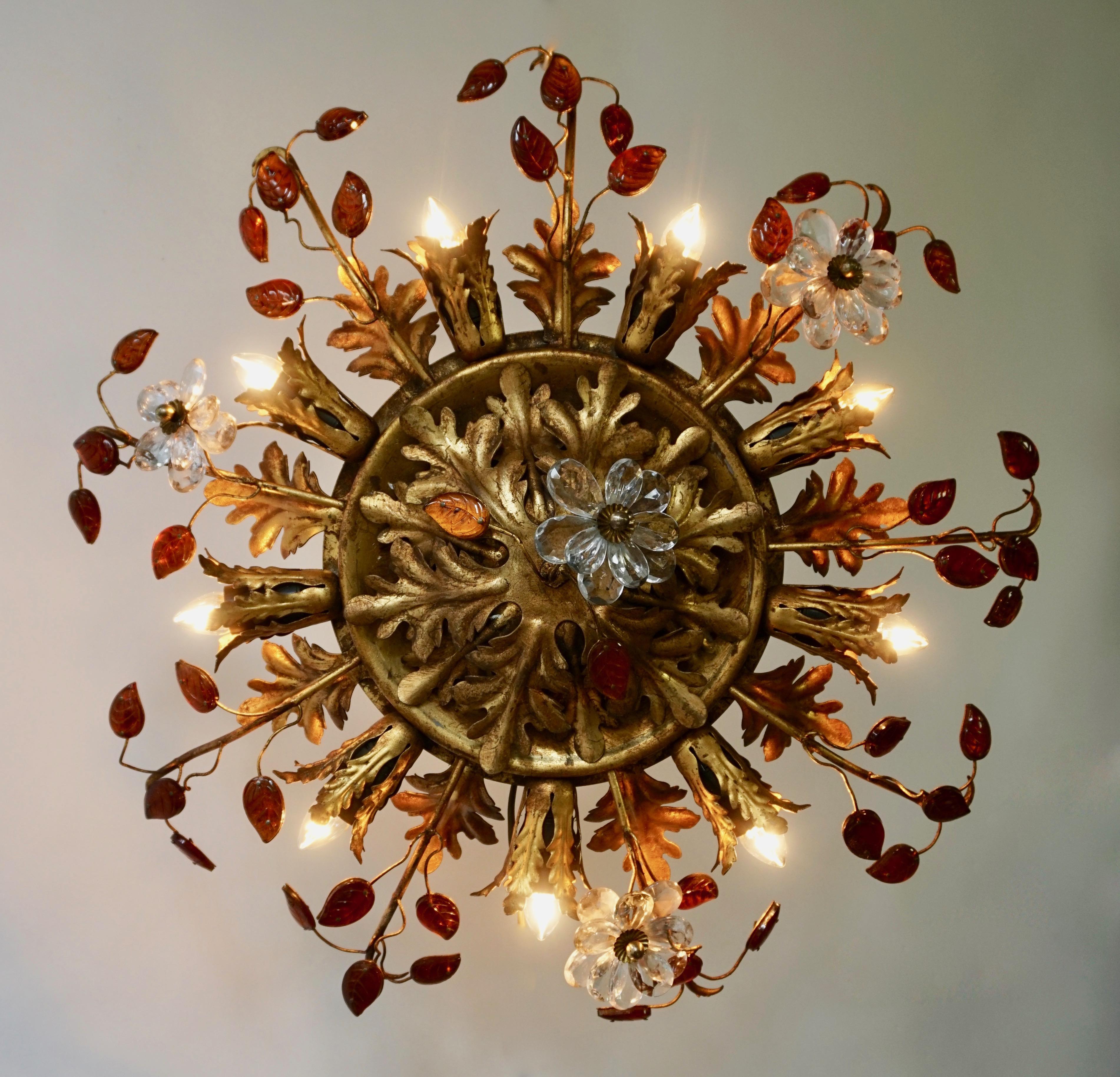 Beautiful flush mount fixture which can be used also as wall sconce - this Italian gilt metal light with gilt metals leaves, small orange glass leaves and transparent flowers is gorgeous! The light fixture has 9-light bulb holders spread around as a