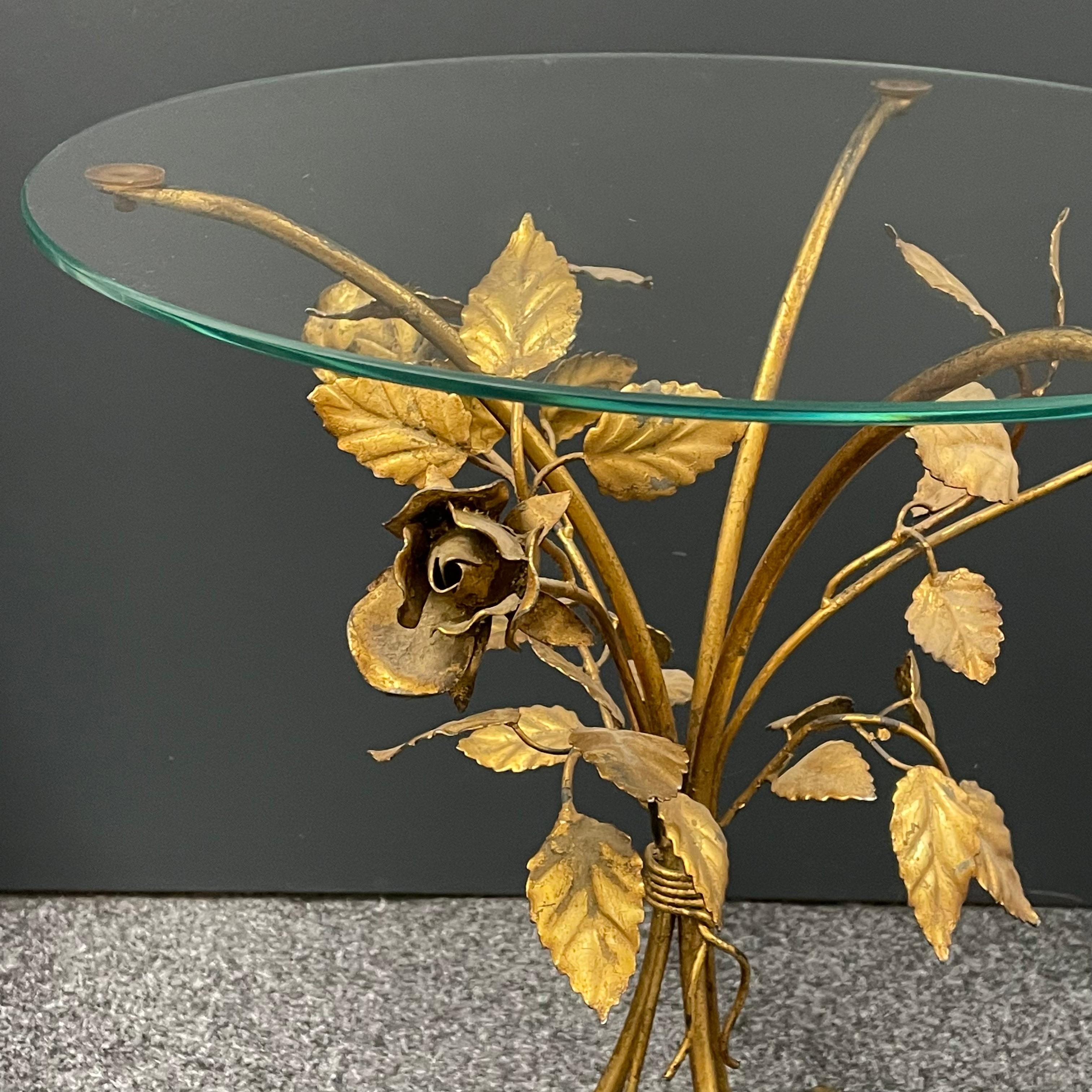 Offered is this beautiful Hollywood Regency gilded rose flower accent table with clear glass top. Made in Italy.