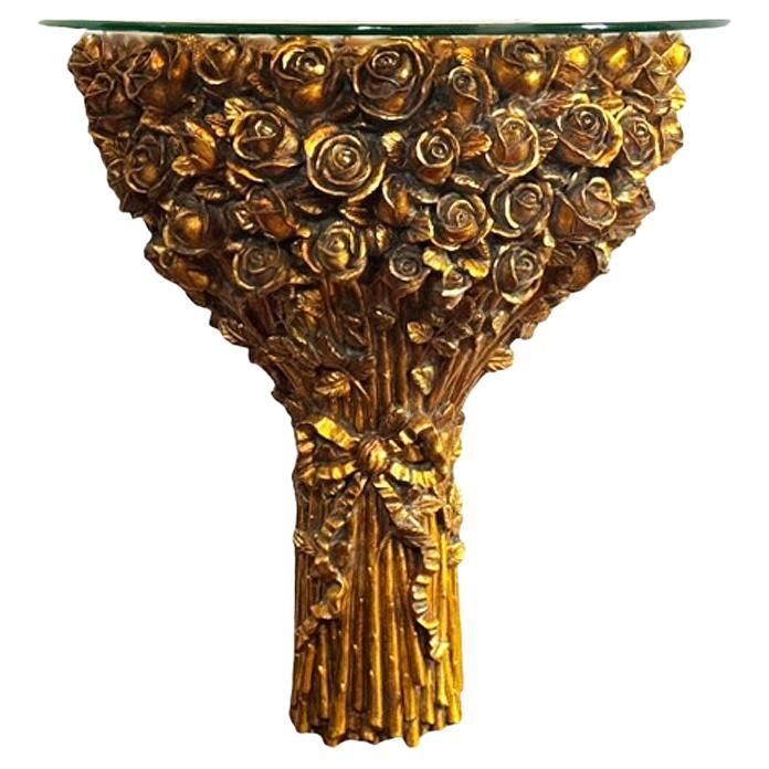 A beautiful wall mounted console table shelf in a demilune form. Consists of gold flowers with clear glass top. Signed made in Italy. 