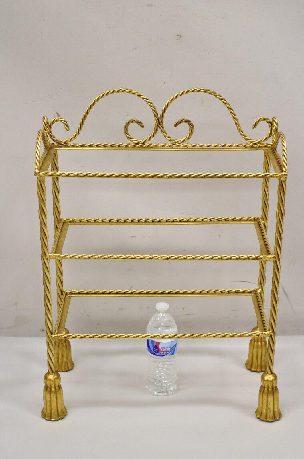Vintage Italian Hollywood Regency gold gilt iron 3 tier shelf small Curio Display Stand (A). Item features a nice small size, 3 tiers, (no glass for shelves), rope design frame, tassel form feet, wrought iron construction, quality Italian