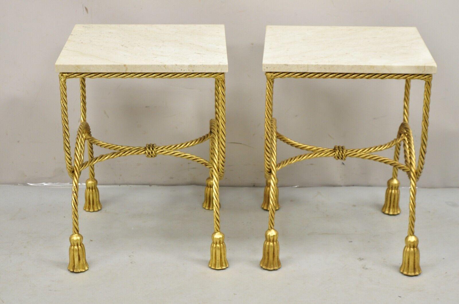 Italian Hollywood Regency Gold Gilt Iron Rope Tassel Marble Top Side Tables - a Pair. Item features marble tops, tassel form feet, iron metal scrolling rope design frame, gold leaf gilt finish, very nice vintage side tables, quality Italian