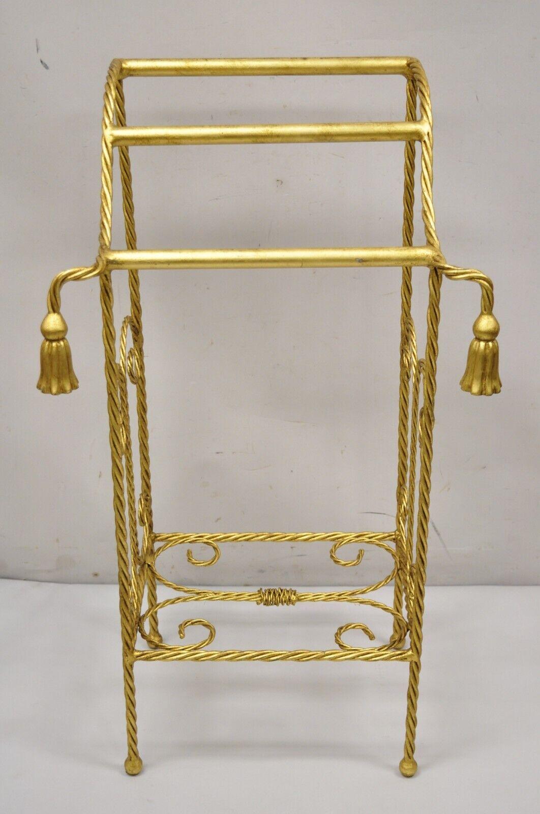 Vintage Italian Hollywood Regency Gold Iron Metal Rope Tassel Form Bathroom Towel Rack Stand. Item features tassel form accents, iron metal frame, lower shelf, gold leaf gilt finish, quality Italian craftsmanship, great style and form. Circa Mid