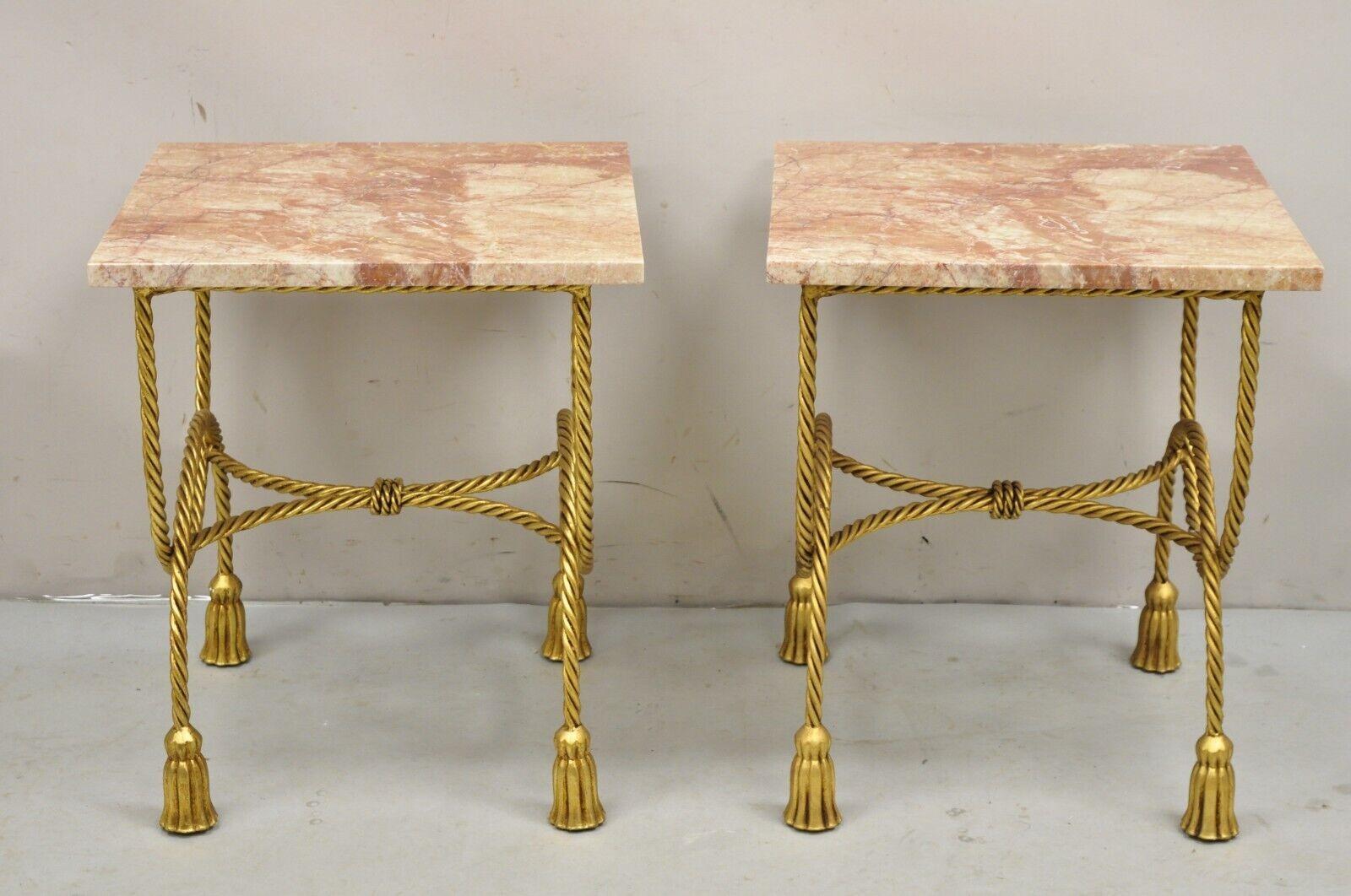 Italian Hollywood Regency Gold Gilt Iron Rope Tassel Rouge Marble Top Side Tables - a Pair. Item features Marble tops, tassel form feet, iron metal scrolling rope design frame, gold leaf gilt finish, very nice vintage side tables, quality Italian