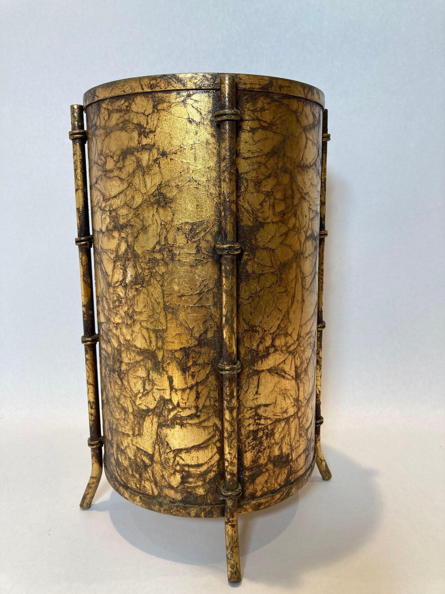 Vintage Italian Hollywood Regency Gold Leaf Small Round Iron Wastebasket Trash Can 1960s.
Vintage Hollywood Regency Italian footed gold leaf gilt faux bamboo finish metal wastebasket, trash can or planter pot stylish cachepot. With its sleek lines