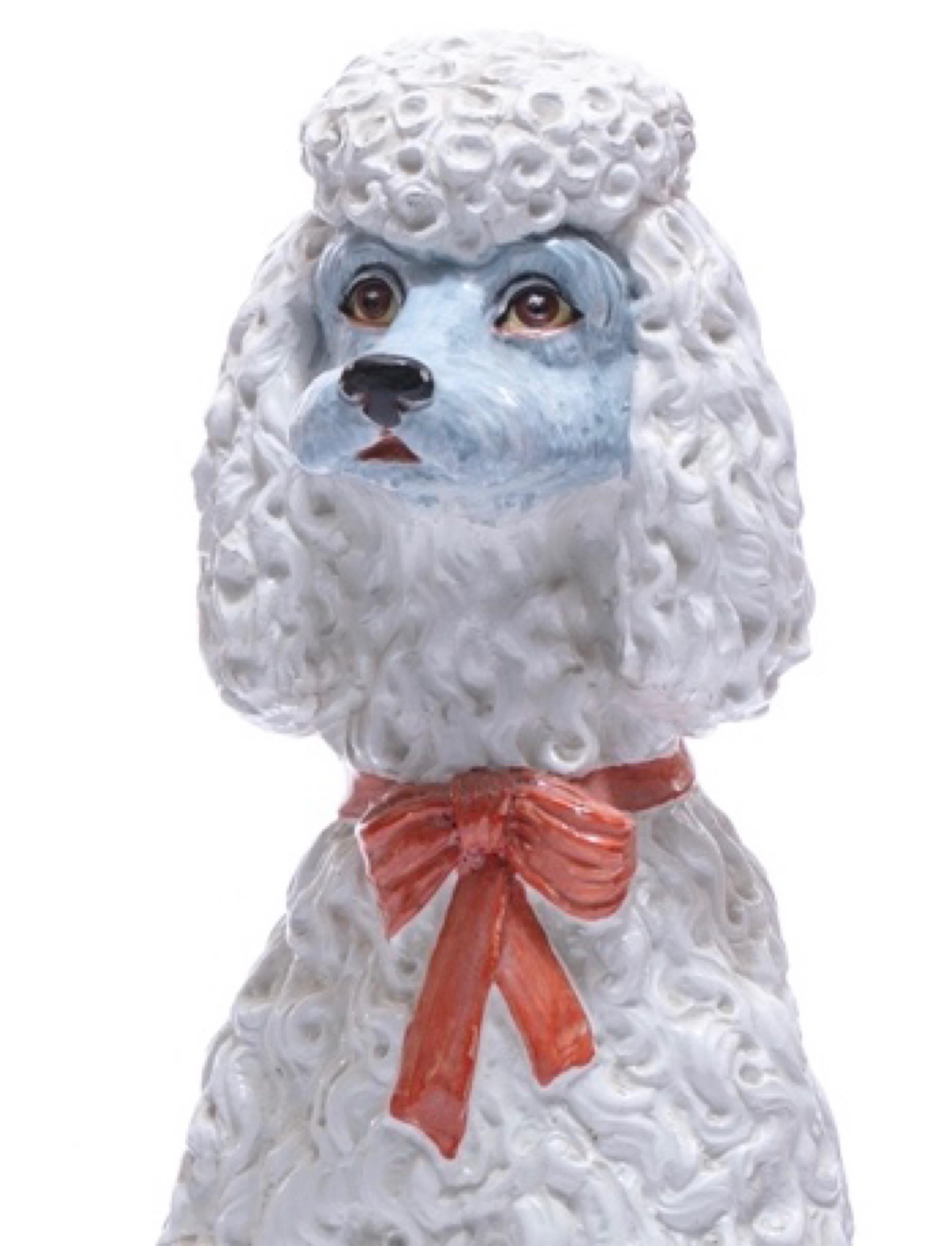 A great pop in any space, this life-size Italian ceramic poodle sculpture is the out of the ordinary accessory that adds a fun, but elegant sensibility. The poodle is in excellent vintage condition for its age - there is surprisingly no damage nor