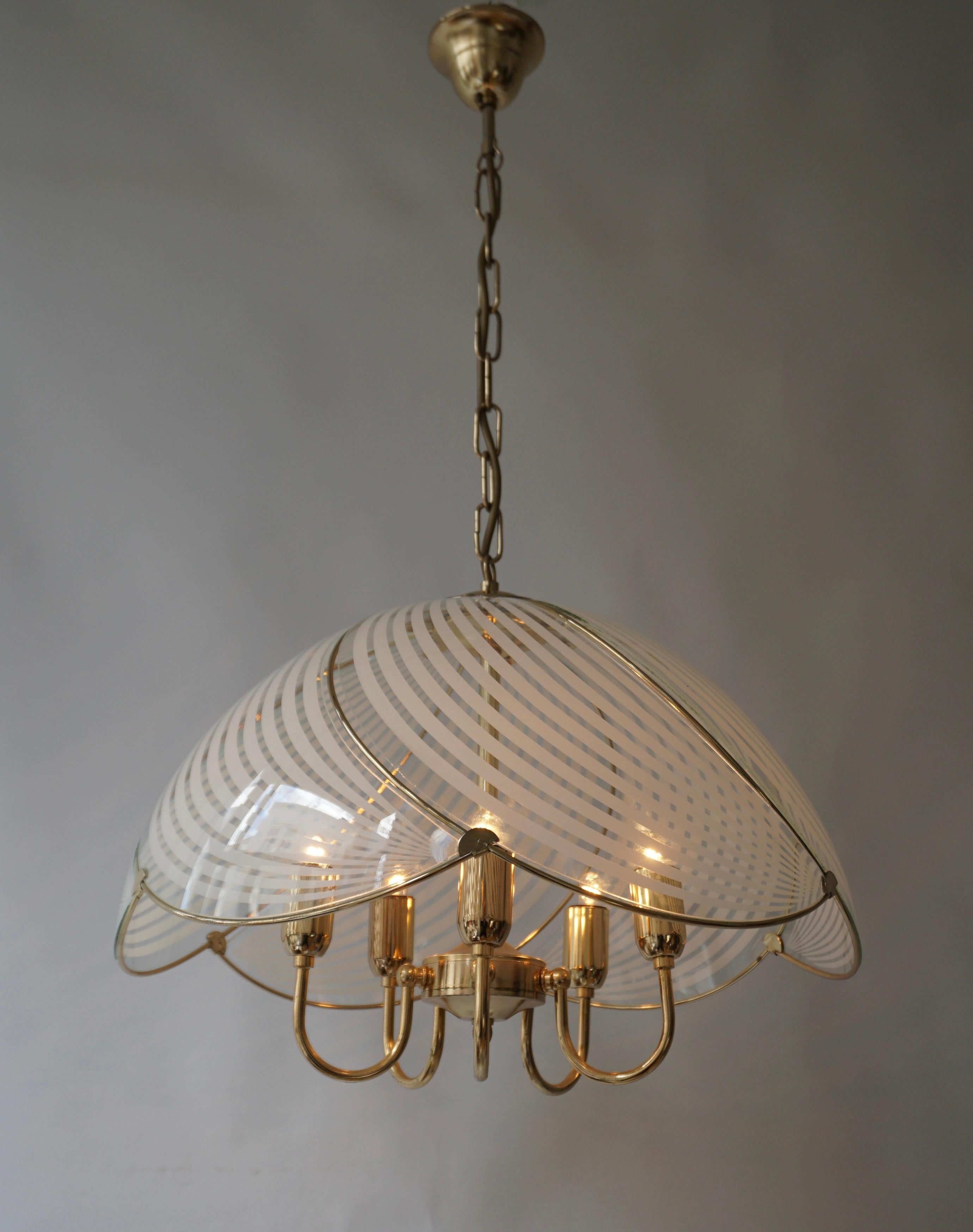 Two Hollywood Regency style pendant lights. 
It has a wavy pattern finished with brass and compliant with the white stripes pattern. It looks like a flower.

The lamp has five sockets for small incandescent lamps with screw base or E14 type LEDs. It