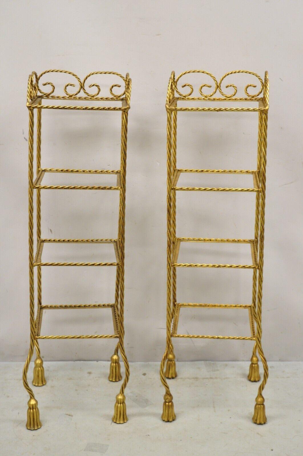 Vintage Italian Hollywood Regency Rope Tassel Gold 4 Tier Iron Display Rack Shelf - Pair. Item features Iron frames, gold gilt finish, tassel form feet, 4 tiers (no glass), very nice vintage pair, quality Italian craftsmanship, nice smaller size.