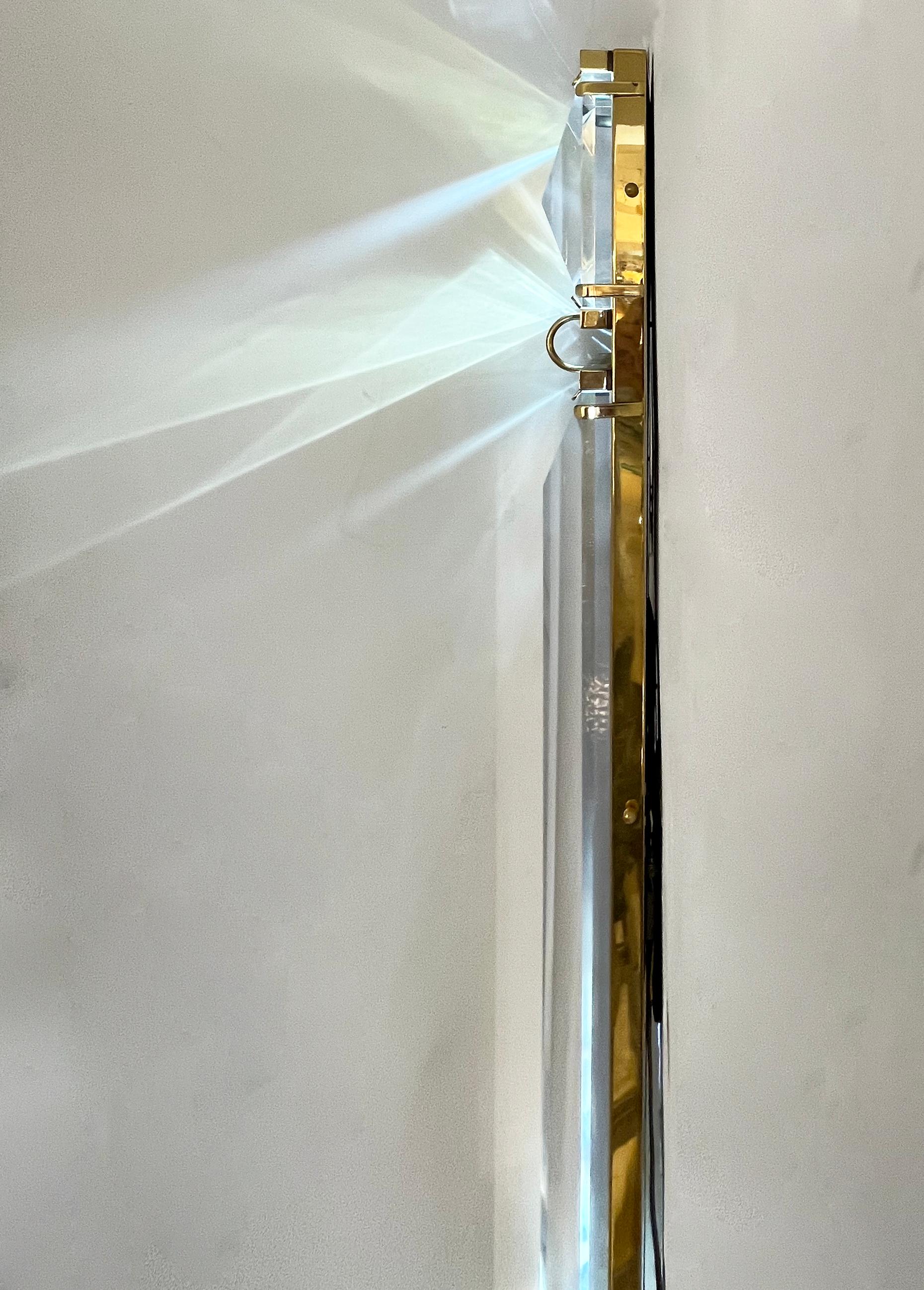 These colossal sconces will leave a statement for any entryway or any space. Unique one-of-a-kind sleek organic design entirely handcrafted in Italy, extremely decorative with sophistication, composed of a handmade brass back plate, with diamond-cut