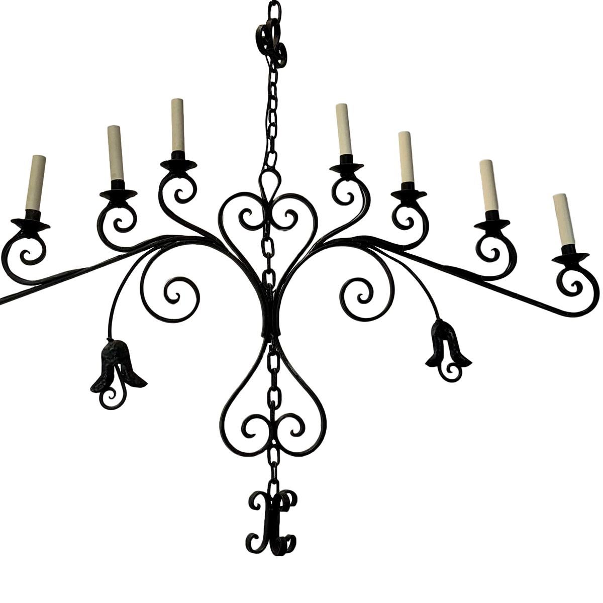 A circa 1950's Italian wrought iron chandelier with 8 lights.

Measurements:
Width: 49