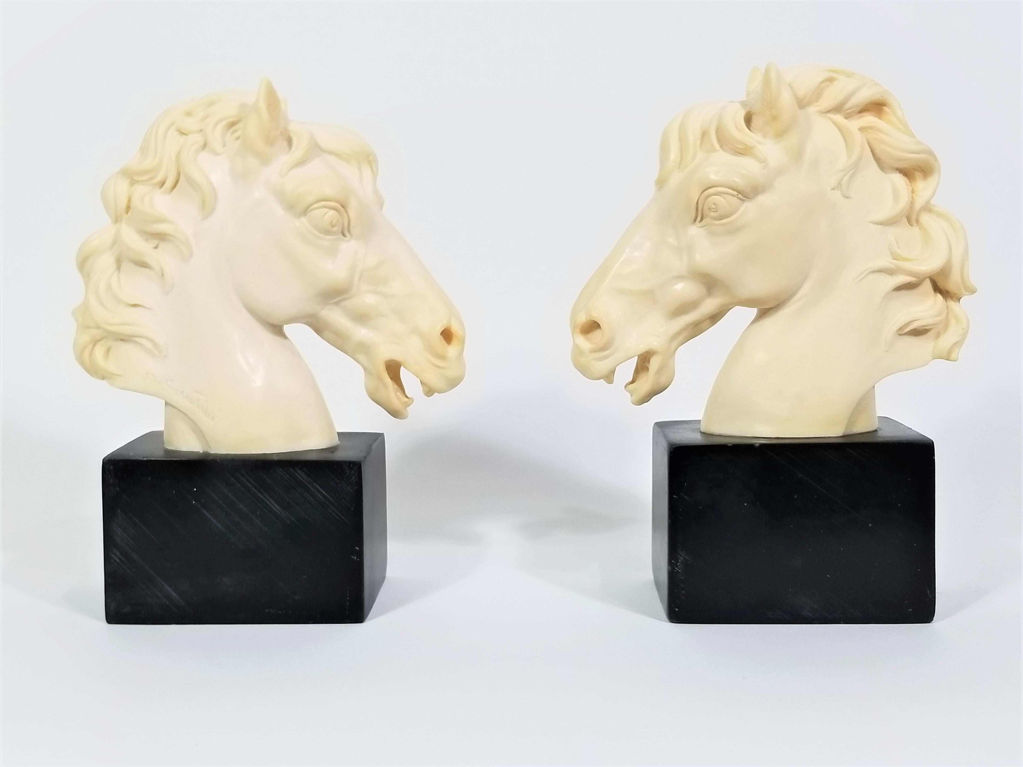 Mid century Italian sculptural Horse bookends. Artist Signed A. Santini. Still retains original marking sticker that reads “Made in Italy” Exceptional detail. 
      