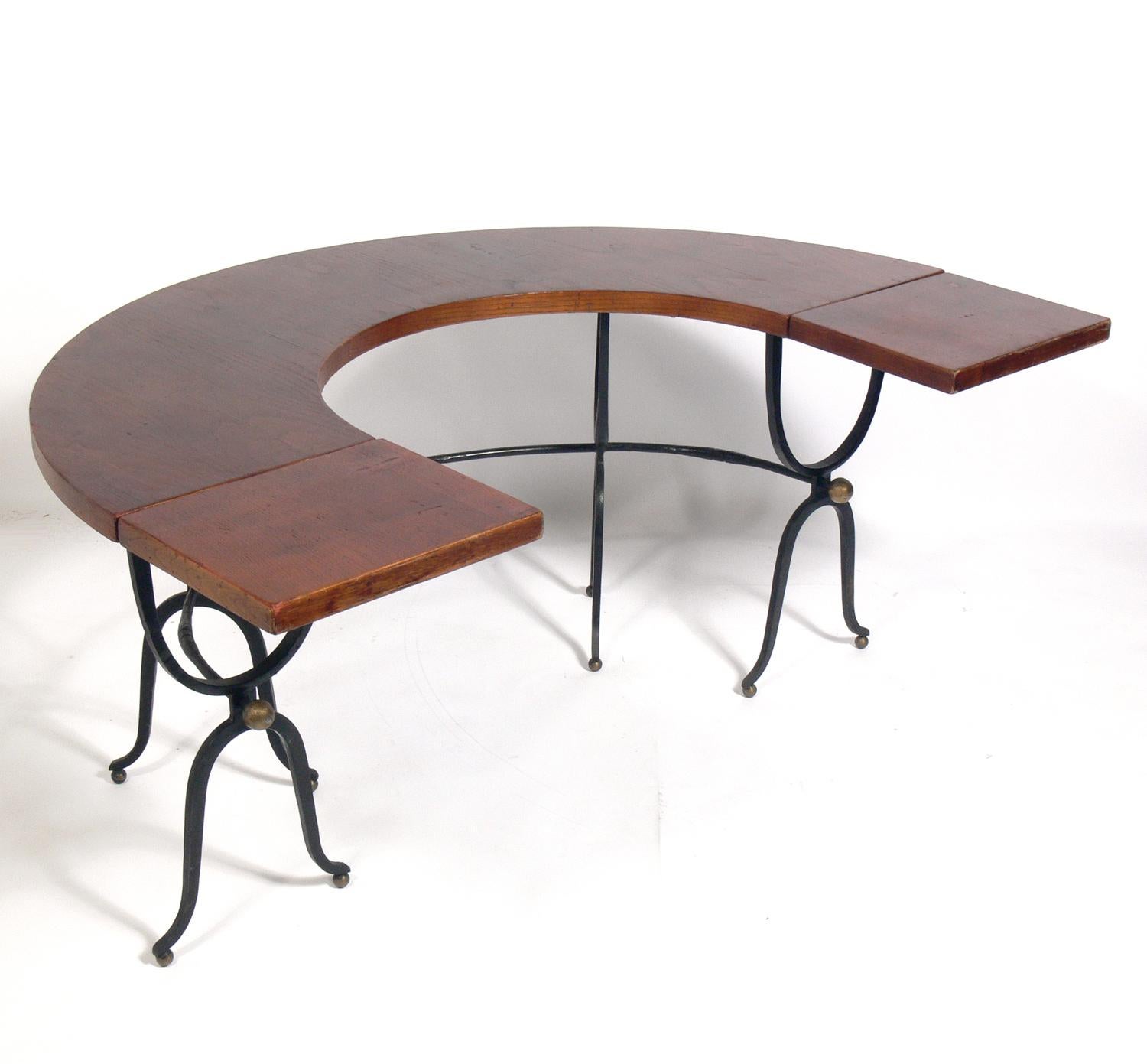 Italian horseshoe shaped desk, Italy, circa 1960s. Elegant form with great function as well, with two drop leaves to provide more desk space when needed. It is a versatile size and can be used as a desk, bar, or serving table. It is currently being